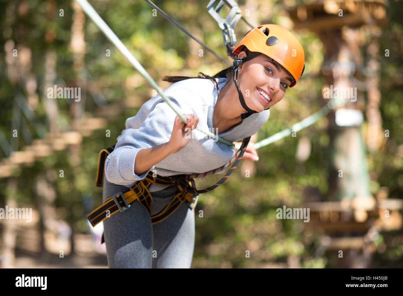 Positive attractive woman leaning forwards Stock Photo