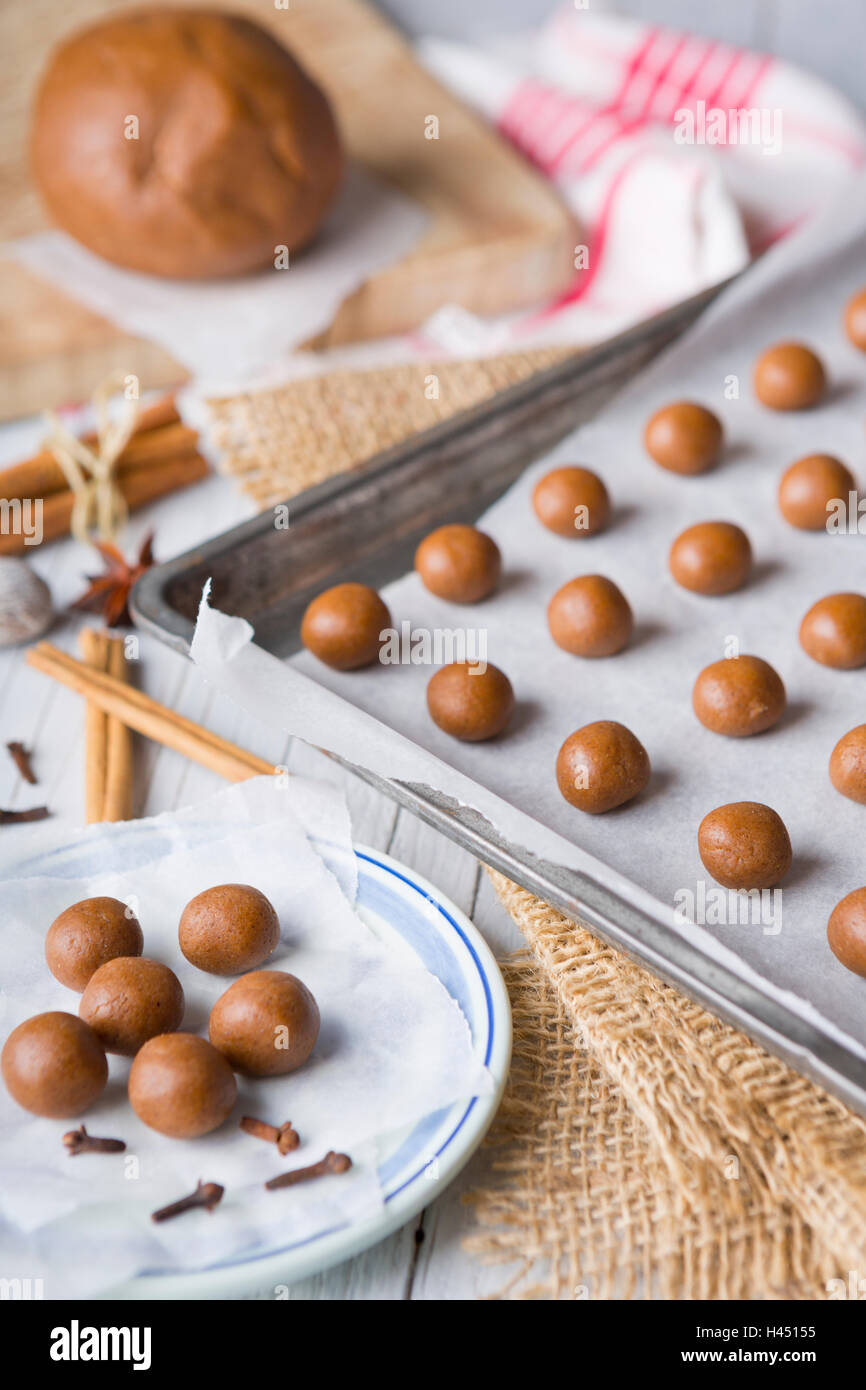 A baking tray with unbaked 'pepernoten' or 'kruidnoten', a Dutch delicacy for Dutch holiday 'Sinterklaas'. Stock Photo