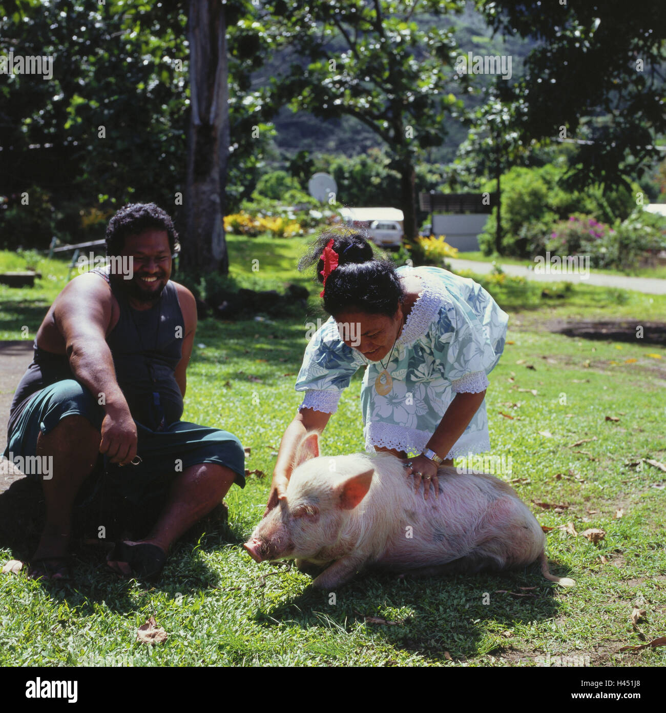 French Polynesia, Tahuata, Vaitahu, meadow, couple, house pig, person, locals, Polynesians, animal, pig, stroke, happy, joy, pride, outside, Stock Photo