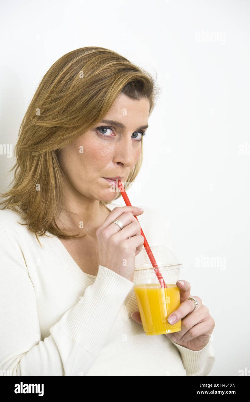 Woman, glass, drinking straw, orange juice Stock Photo Alamy
