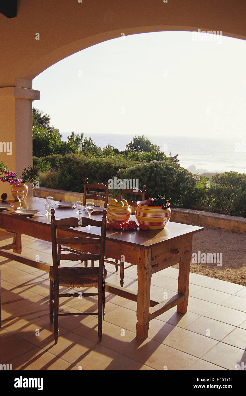 Terrace, roofs, table, chairs, view, sea, terrace table, outside, Mediterranean, country house, country house style, wooden piece furniture, St. furniture, terrace piece furniture, deserted, holiday mood, curves, veranda, sea view, covered, flowers, fruitbowls, Stock Photo