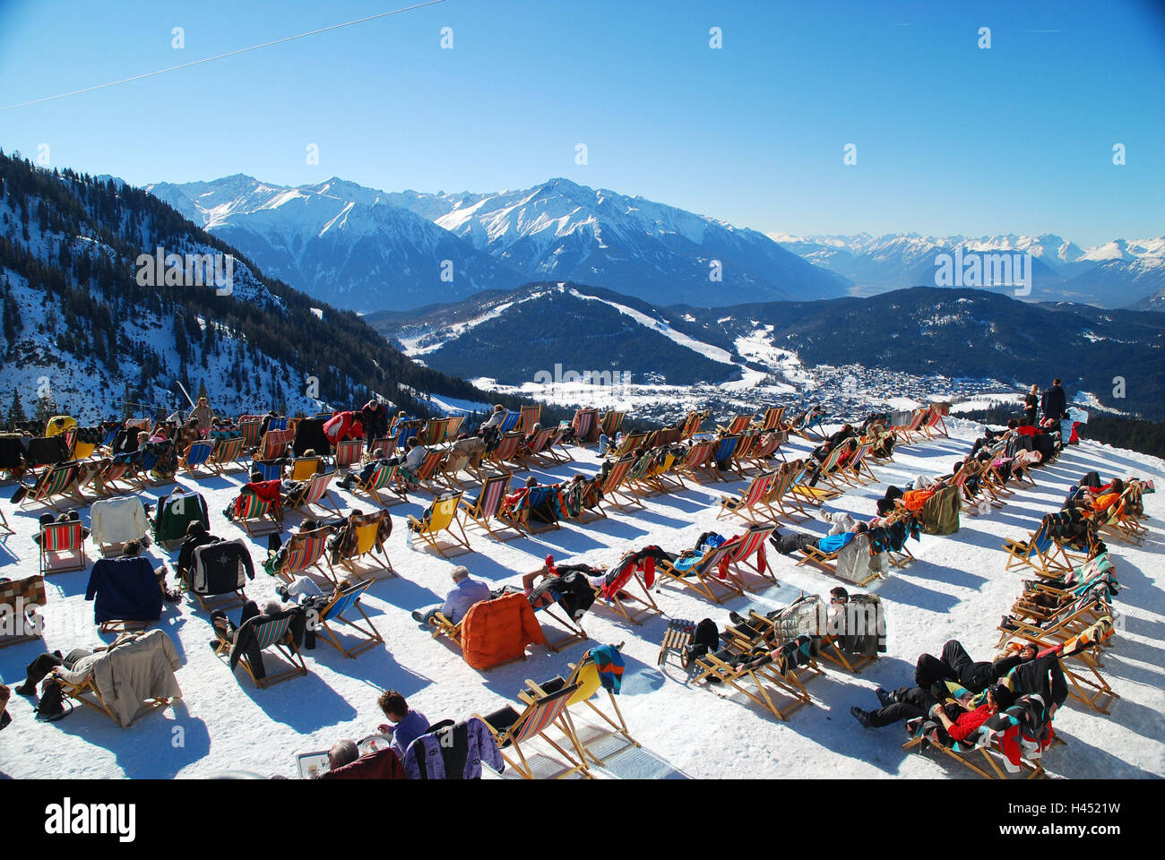 Austria, Tyrol, sea field, mountain horse hut, sun terrace, deck chairs, tourists, Nordtirol, tourist resort, tourism, tourism, winter sports, winter sports place, winter sports area, snow, cloudless, sunny, people, leisure time, hobby, break, rest, view, alps, mountains, panorama, Stock Photo