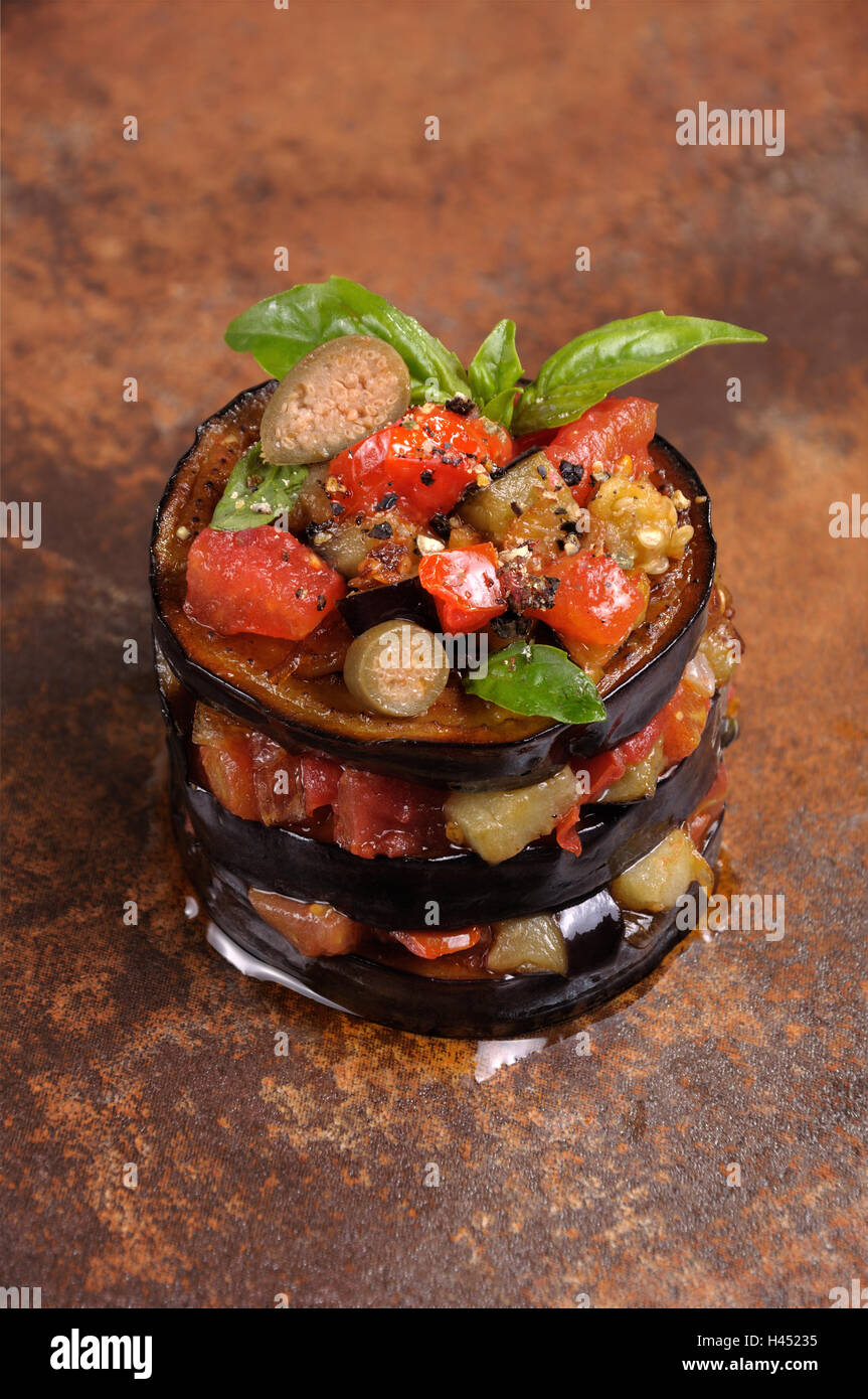 fried eggplant with diced tomatoes, capers, flavoured spices Stock