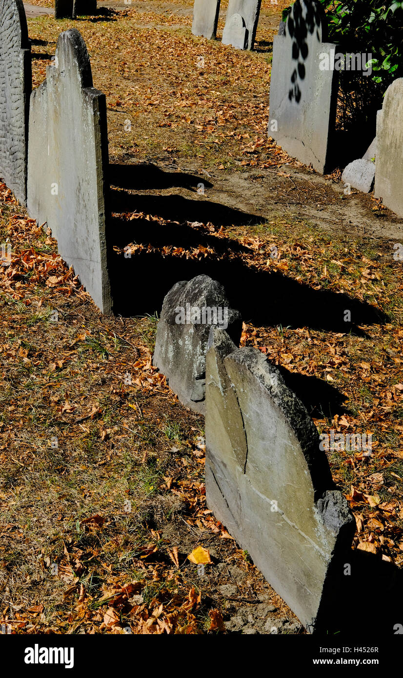 Haunting image of old graves as seen in a Boston, MA, churchyard in late fall. Many are hundreds of years old. Stock Photo