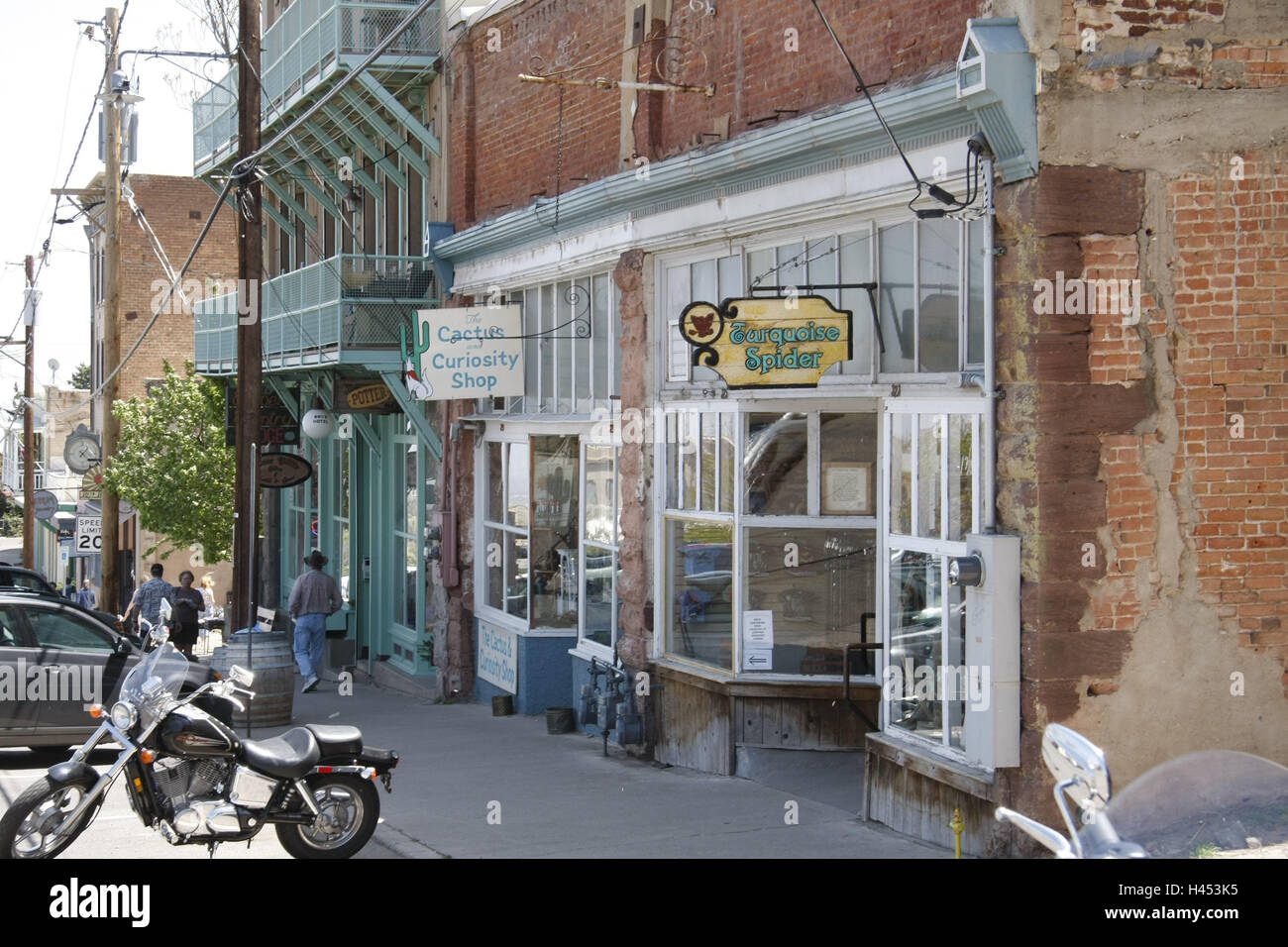 The USA, Arizona, Black Hills, Jerome, shops, mountain village, mine town, ghost town, tourism, place of interest, building, brick building, architecture, renovation-destitute, pedestrian, person, motorcycle, cars, park, Stock Photo