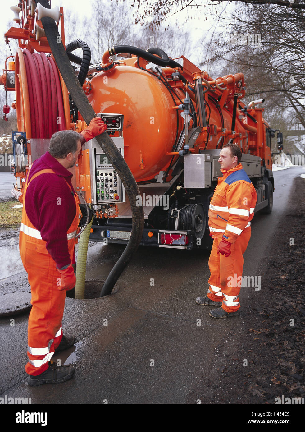 Germany, street, sewage disposal, suction vehicle, men, pump out, channel, disposal company, service, person, employee, two, flush, empty, channel cleaning, Spülfahrzeug, disposal vehicle, sewage technology, sewage disposal, pump out, liquid disposal, occupation, work, rinse cesspool, sewage mine, feces, liquid, sewage, disposal, removal, cleanness, vehicle, truck, special vehicle, commercial vehicle, collective vehicle, security clothes, protective clothing, warning protective clothing, luminous colours, orange, reflect, Stock Photo