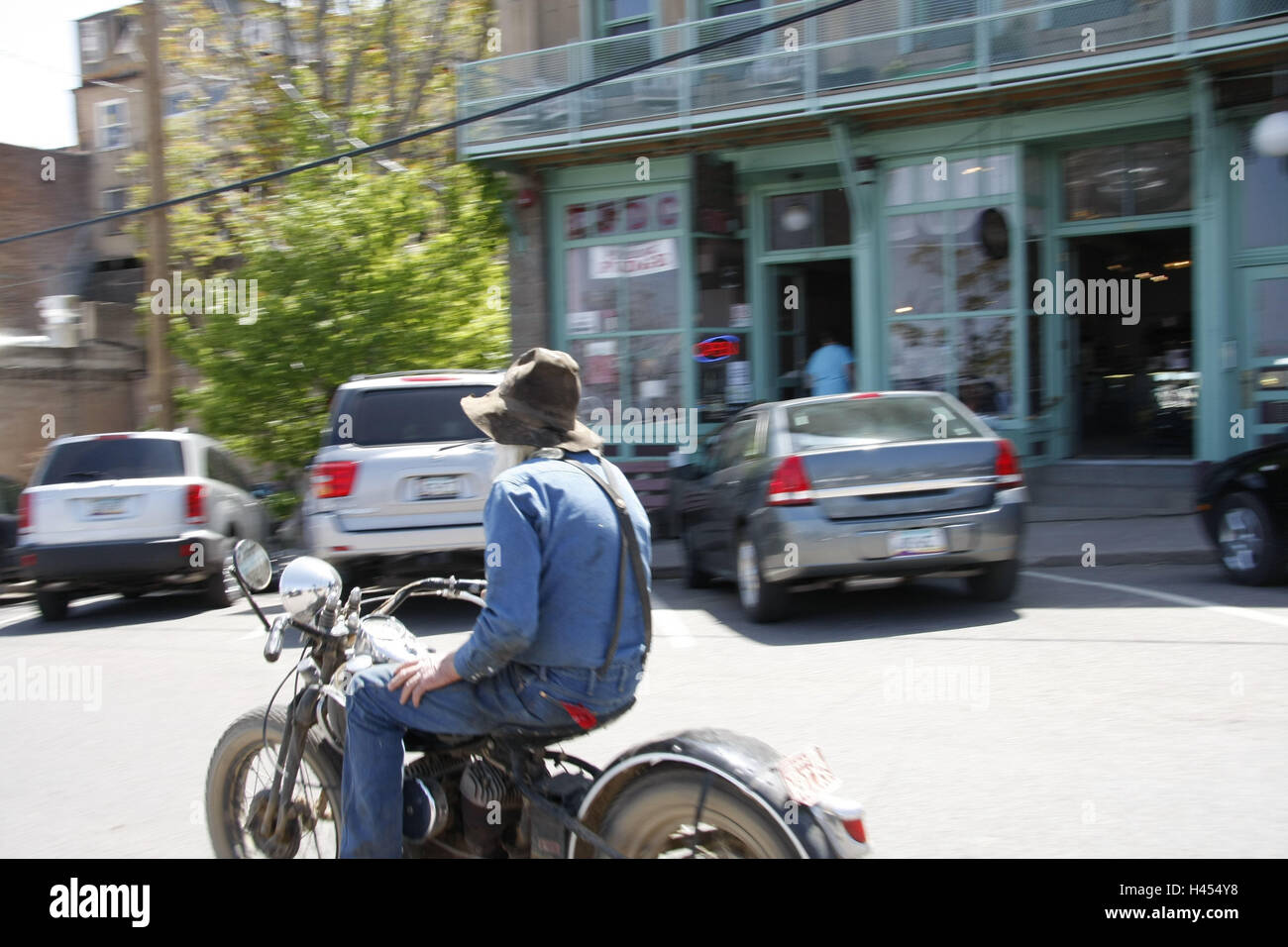 The USA, Arizona, Black Hills, Jerome, street, motorcyclist, mountain village, mine town, ghost town, strangely, tourism, place of interest, building, business, cars, strangely, man, motorcycle, senior, blur, Stock Photo