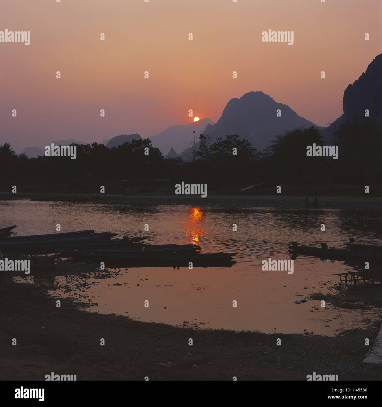 Laos, Vang Vieng, river Nam Song, mountains, sundown, Asia, South-East Asia, destination, tourism, limestone rock, riverside, scenery, nature, the sun, afterglow, boots, mirroring, water surface, Stock Photo