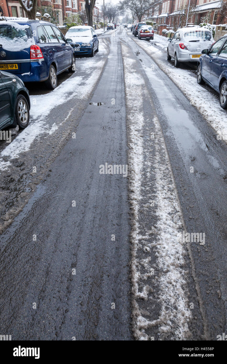 Slushy road. Slush on a residential street in Winter, Nottinghamshire, England, UK Stock Photo