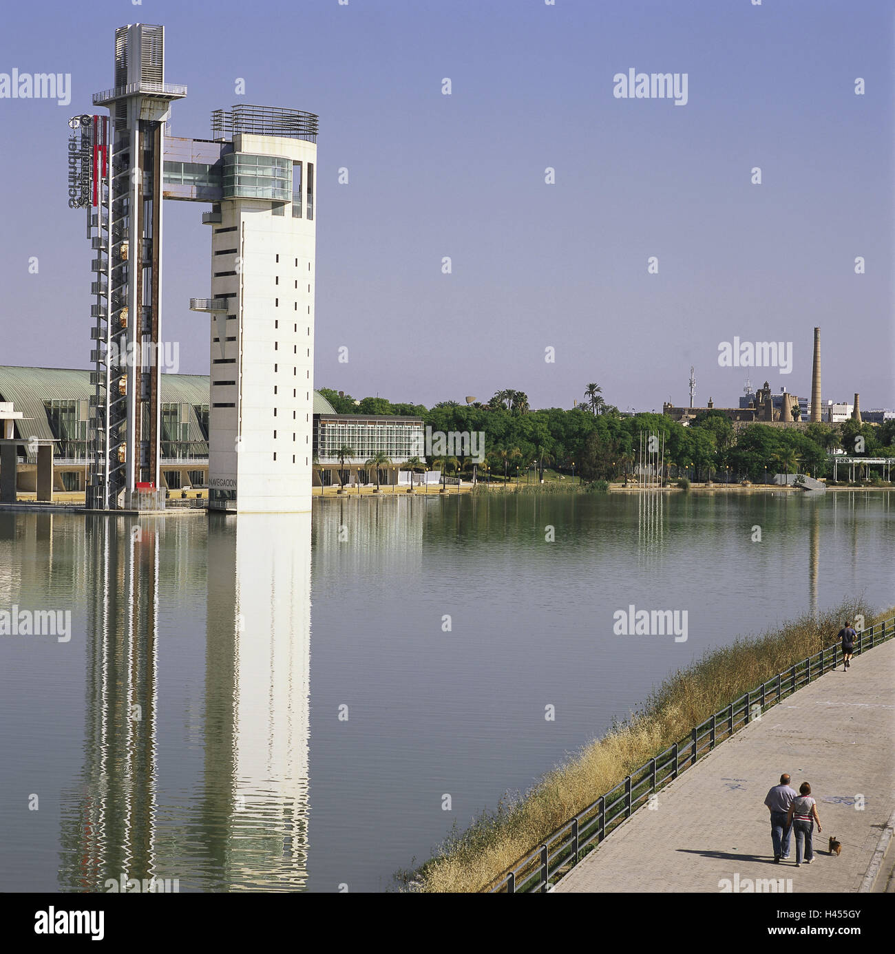 Spain, Andalusia, Seville, Parque, Tecnologico Cartuja 93, Torre Schinder, Europe, town, destination, place of interest, building, structure, architecture, tower, tower building, world exhibition, Expo, river, water, shore, person, walk, Stock Photo