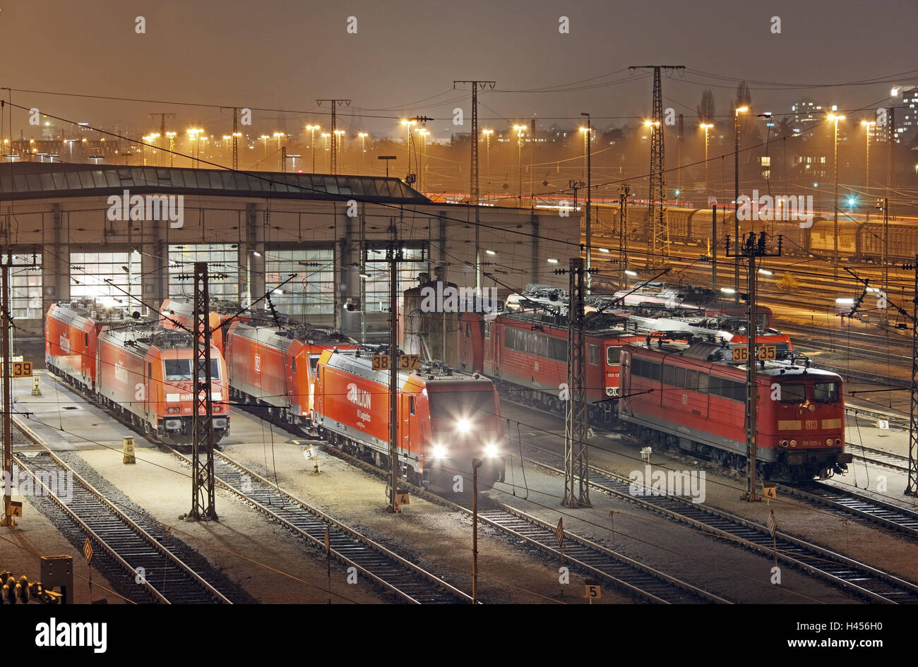Locomotives, tracks, engine shed, night photography, Stock Photo
