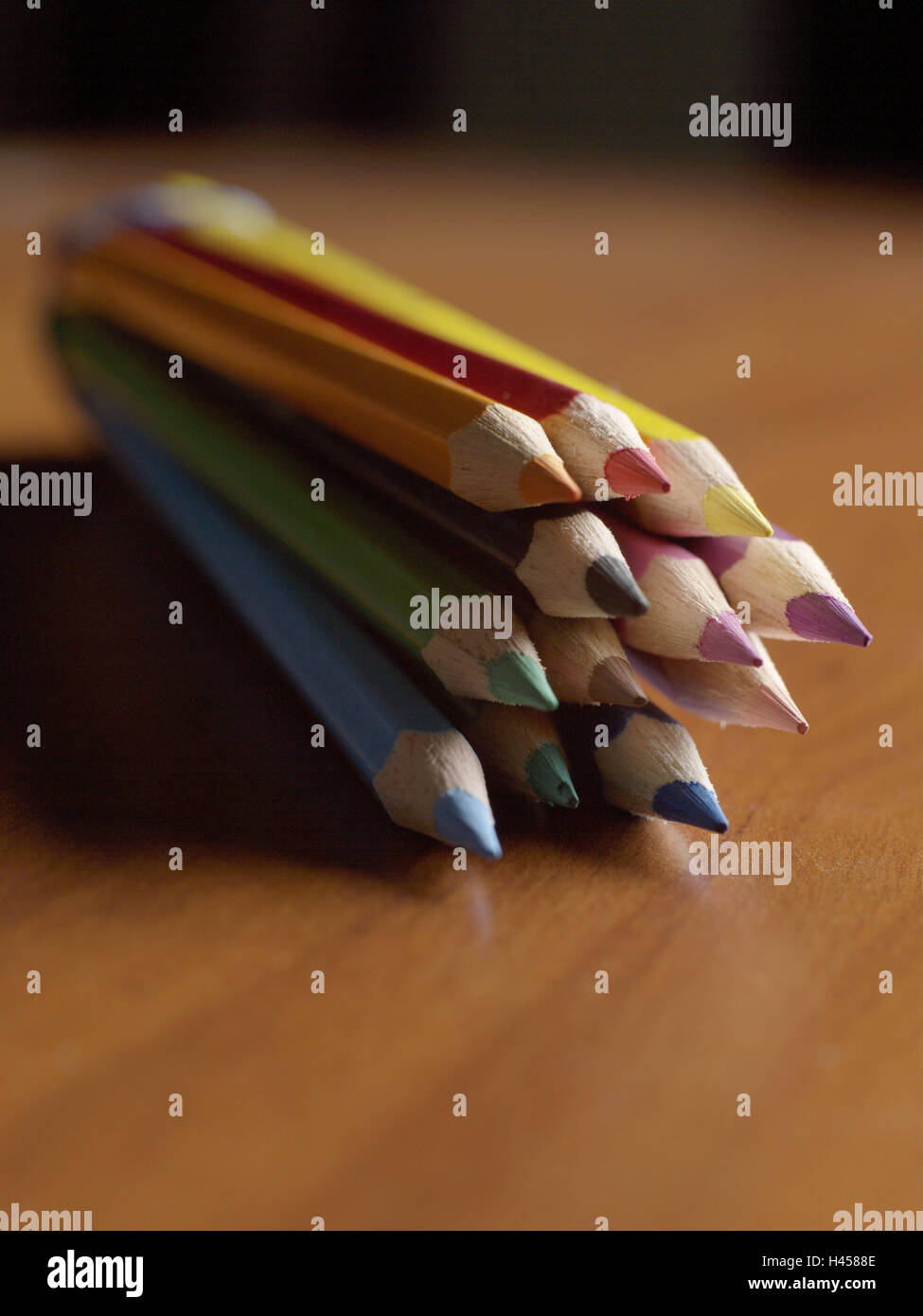 Coloured pencils, colours, passed away, paint colour pencils, school pens, pegs, pens, mines, brightly, pointed, anew, colourfully, in perspective, icon, sign, childhood, wooden table, reflexion, background, vague, Stock Photo