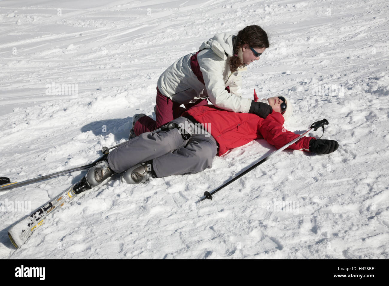 Ski Runway Women Two First Aid Snow Skiers People Lie Injures Unconsciously Ski Accident Sports Accident Accident Danger Of Collision Fall Ski Clothes Ski Cap Ski Glasses Anorak Ski Gloves Ski Ski