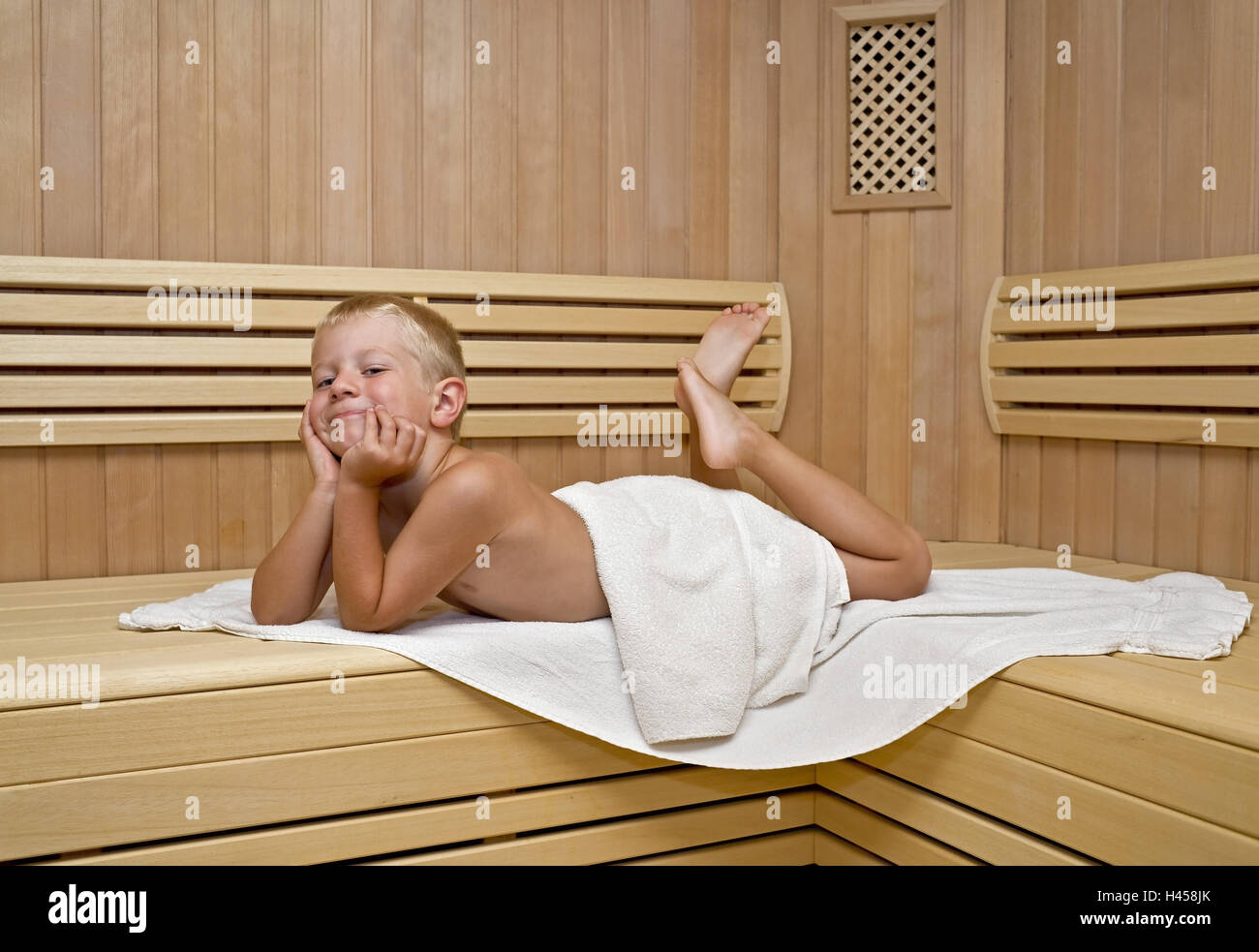 A boy, 5 years, in a sauna, lie, model released, Stock Photo