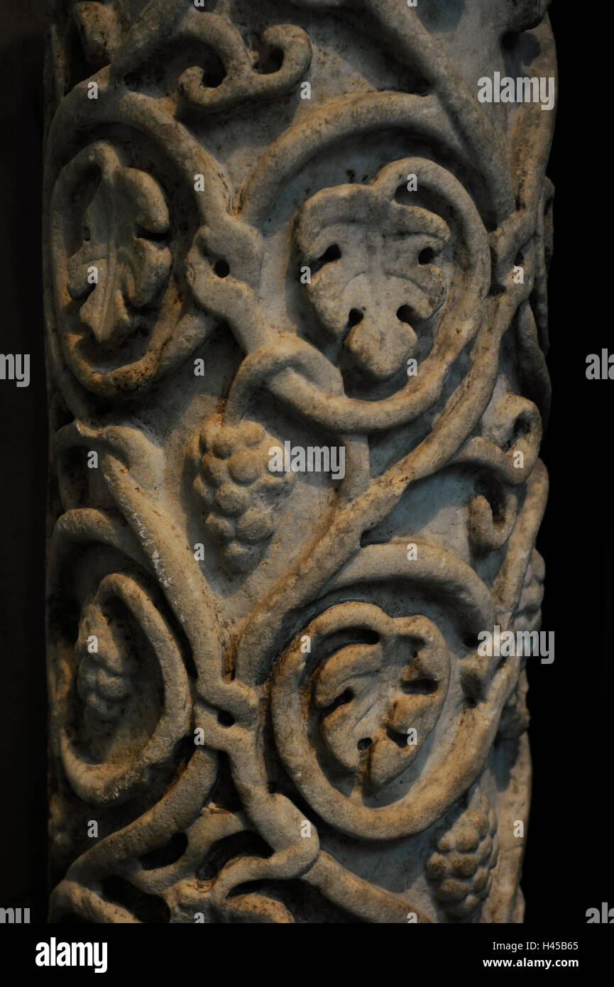 Embossed column decorated with acanthus leaves, vine tendrils and bunches of grapes. Remains of red polychrome. Marble. Early Christian Period. 5th century. Museum of Mediterranean and Near Eastern Antiquities. Stockholm. Sweden. Stock Photo