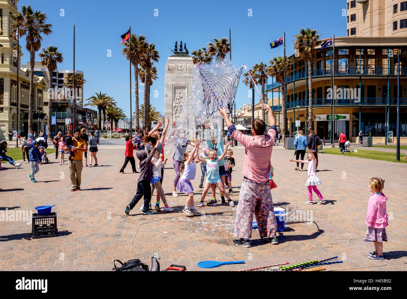 Children playing in 'Moseley Square' Glenelg, South Australia's most popular seaside entertainment area. Stock Photo