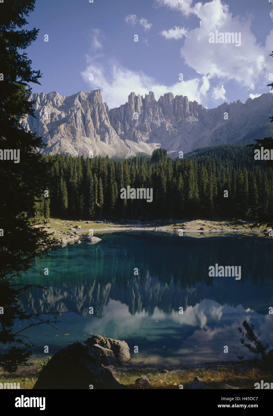 Italy, the Dolomites, Trentino, Lago de Carezza, mountain Latemar, mirroring, water surface, alps, Alps region, South Tyrol, nature, Karersee, mountain lake, lake, waters, edge the forest, woodland, wood, lime alps, mountains, mountains, mountain region, scenery, rest, silence, loneliness, Stock Photo