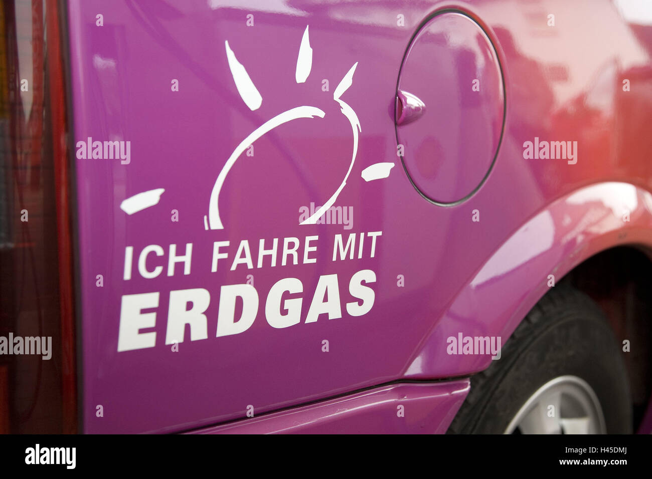 Natural gas car, gas cap cover, label, detail, car, vehicle, mauve, tank, slogan, natural gas, refuel, energy prices, energy, alternatively, environment, ecology, fuel, raw material, cleanly, environmentally friendly, costs petrol, mobility, Stock Photo