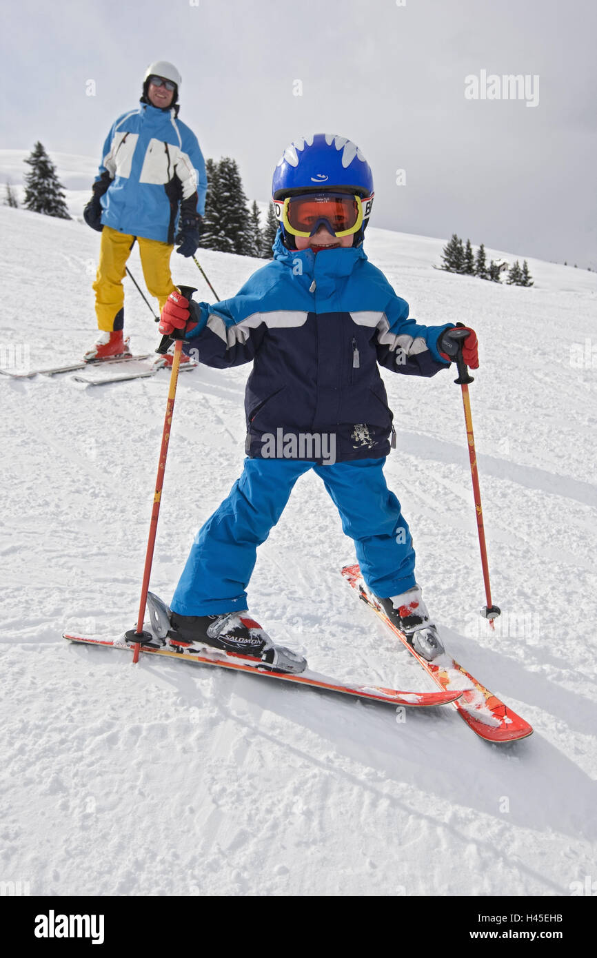 Switzerland, Surcuolm, skier, child, ski suit, ski sticks, plough position, Stock Photo