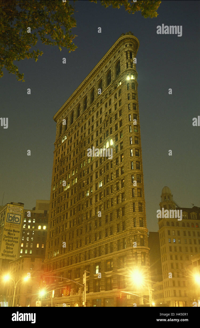 The USA, New York city, Flatiron Building, night, illuminateds, Manhattan, landmarks, buildings, architecture, Broadway, street lights, street lamps, Stock Photo