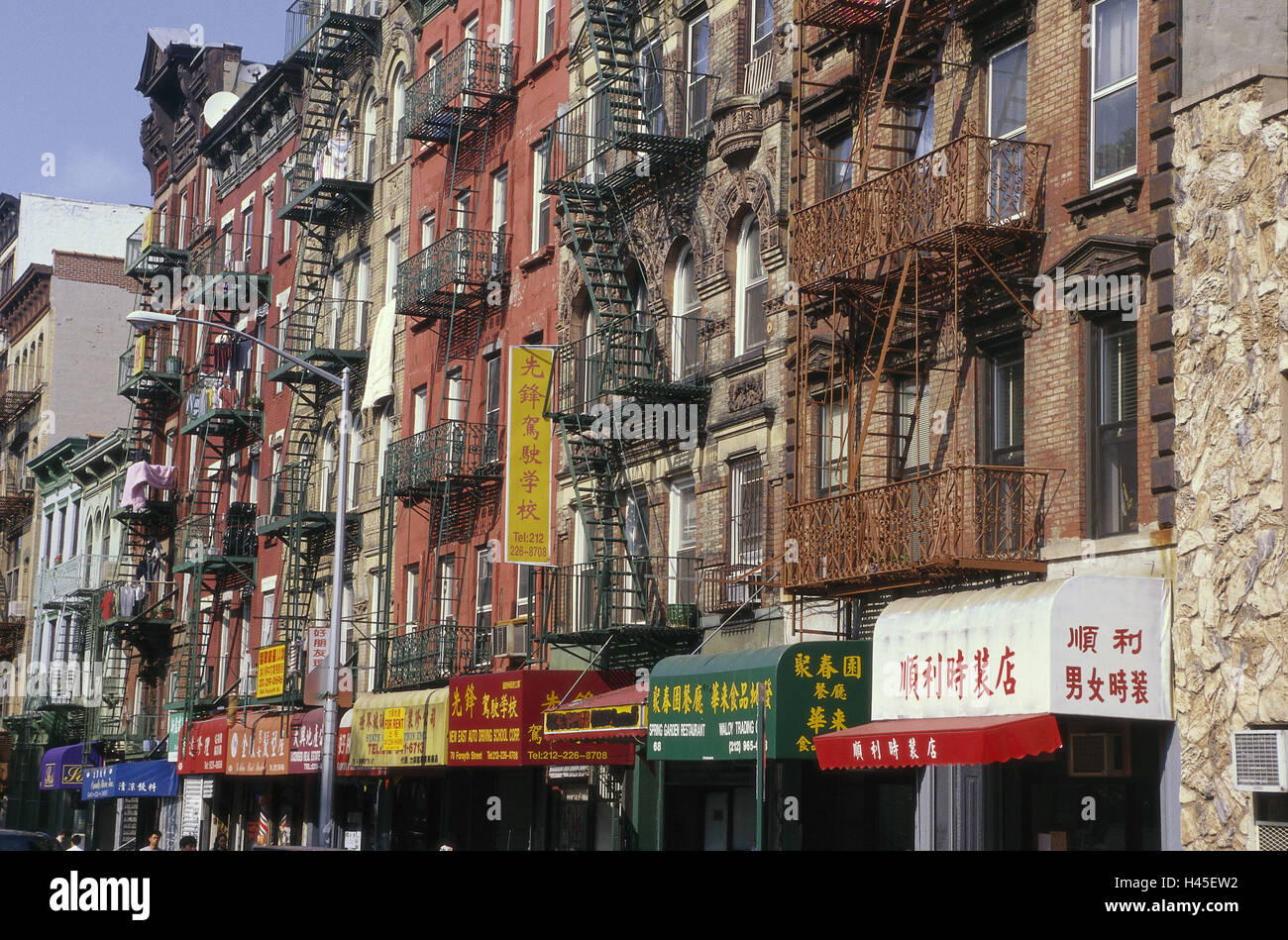 The USA, New York city, Chinatown, house line, Manhattan, residential district, fire escapes, fire escapes, facades, house facades, shops, shops, windows, residential houses, dwelling houses, flatlets, Stock Photo