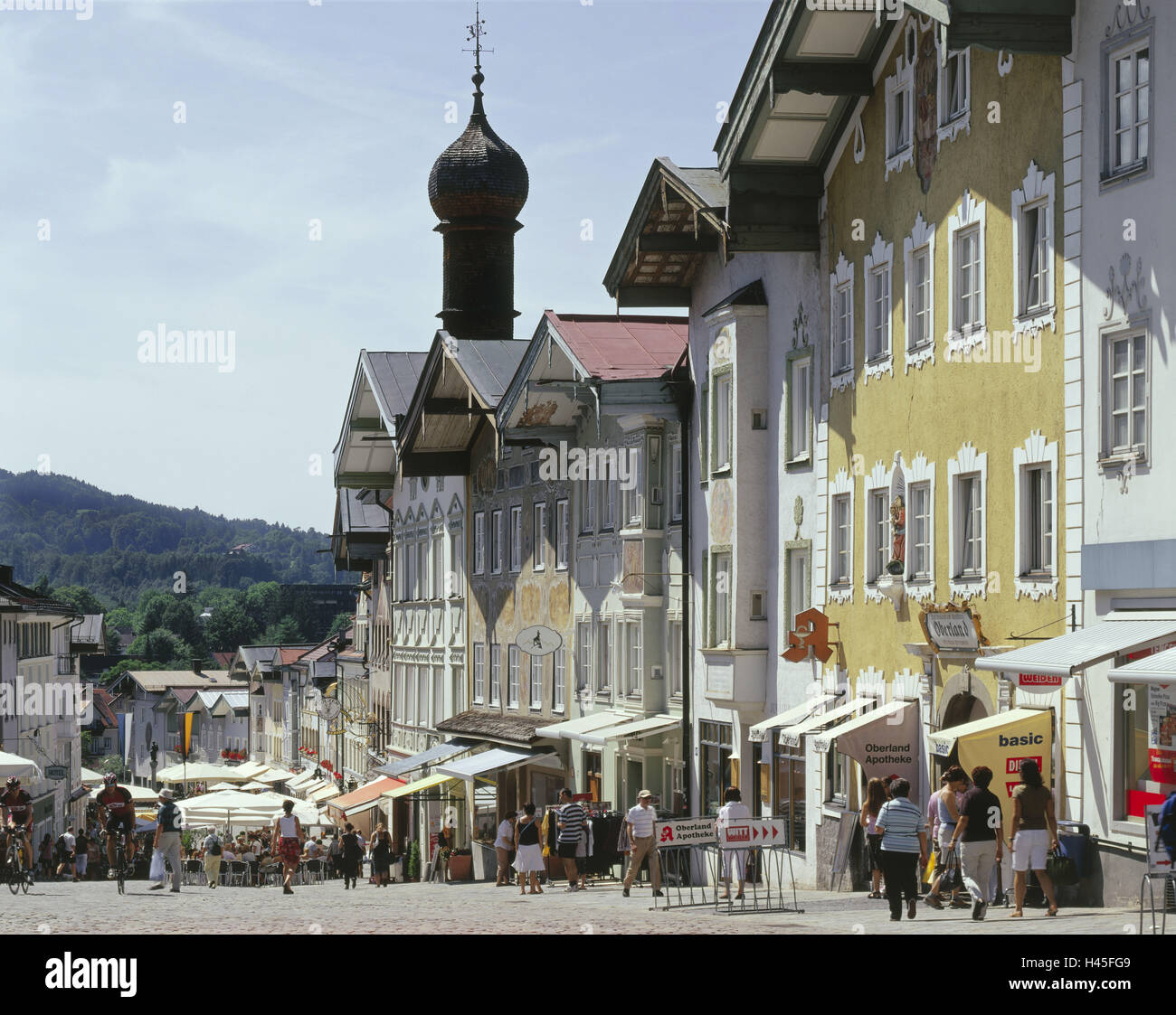 Germany, Bavaria, bath Tölz, pedestrian area, town, provincial town, centre, Isar valley, Upper Bavaria, houses, historically, Marktstrasse, city centre, conservation monuments and historic buildings, tourist, shopping street, Marktstrasse, passer-by, person, pedestrian, street cafes, display screens, Upper Bavaria, summer, terrace, bulbous spire, health resort town Stock Photo