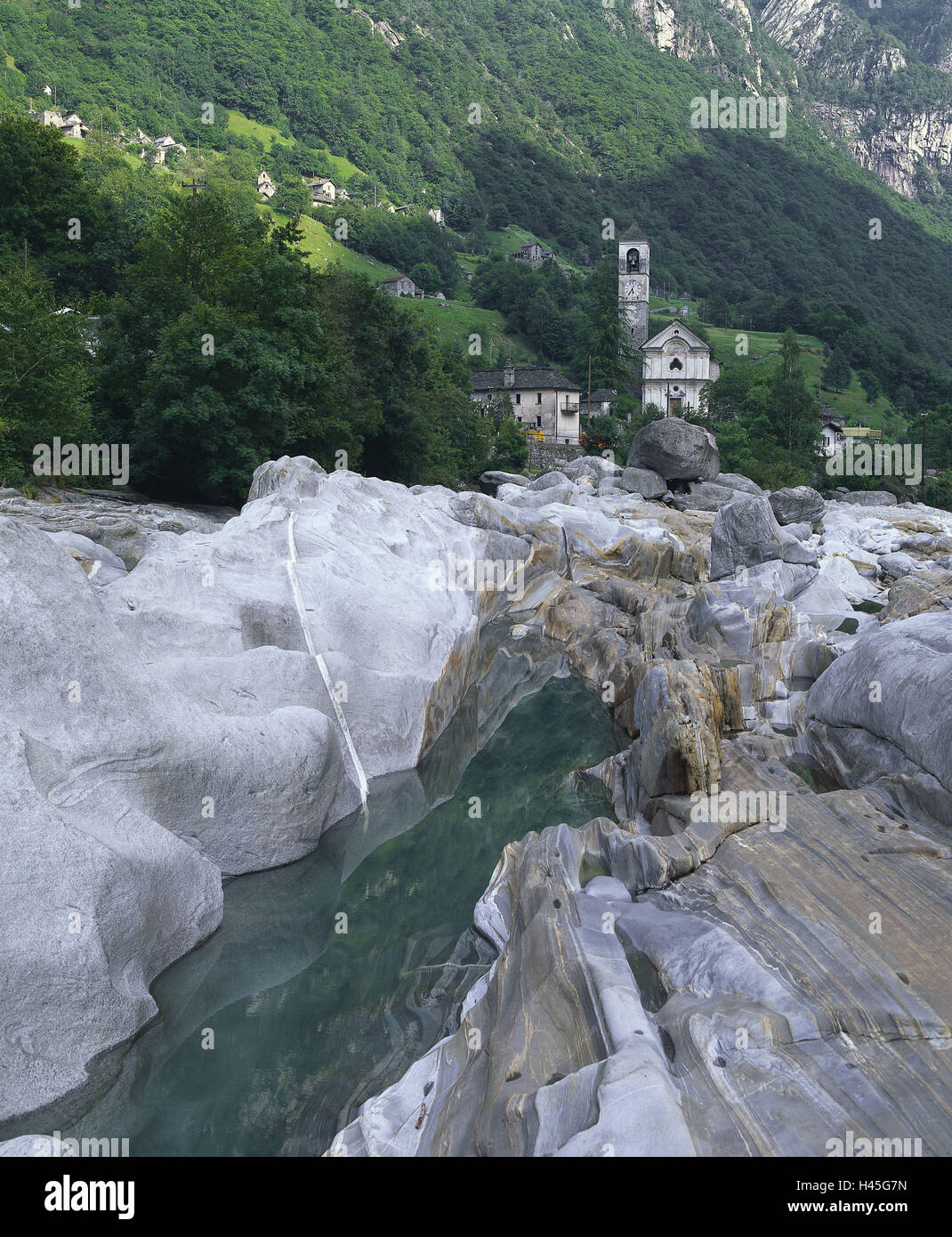Switzerland, canton Ticino, Valle Verzasca, Lavertezzo, mountain river, Verzascatal, valley, village, place, church, steeple, mountain river, waters, rock, granite, rock, flatly, incredibly, place of interest, formation, bile formation, scenery, mountain wood, wood, silence, rest, mountains, alps, alp room, season, summer, sunshine, shade, nobody, Stock Photo