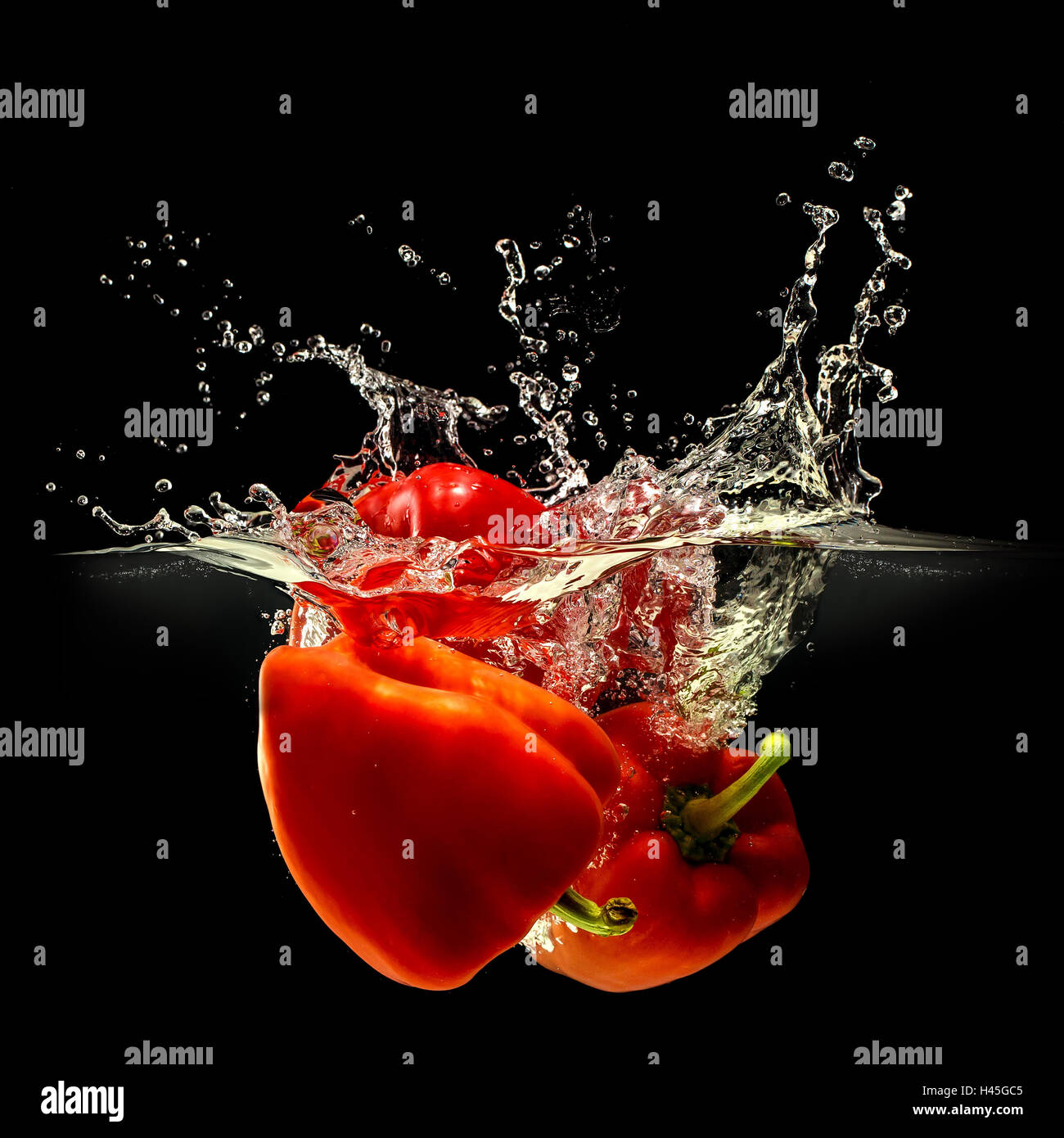 Group of bell pepper falling in water on black Stock Photo Alamy