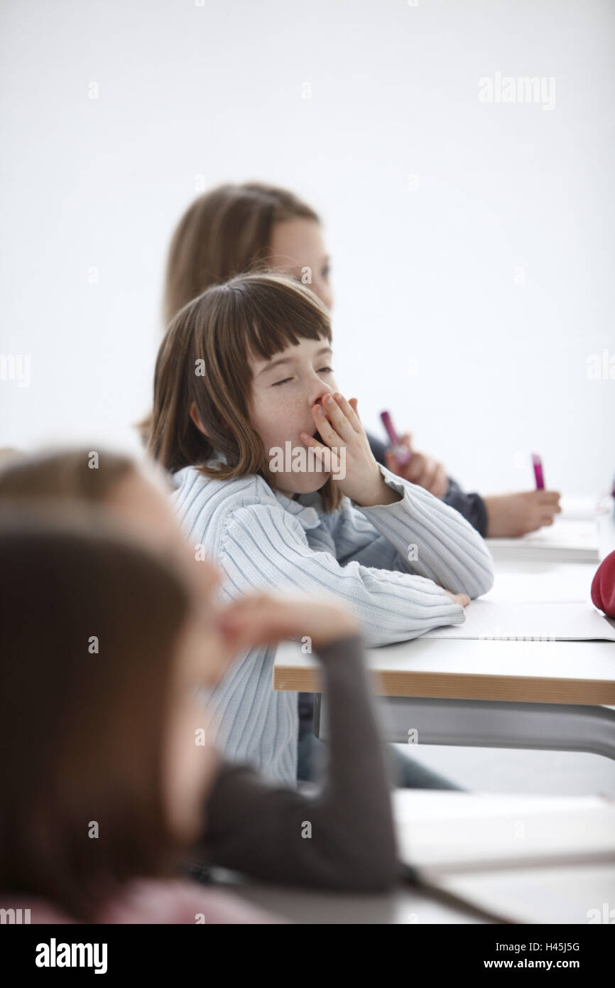 Girl, school desk, tired, yawning, lessons, Stock Photo