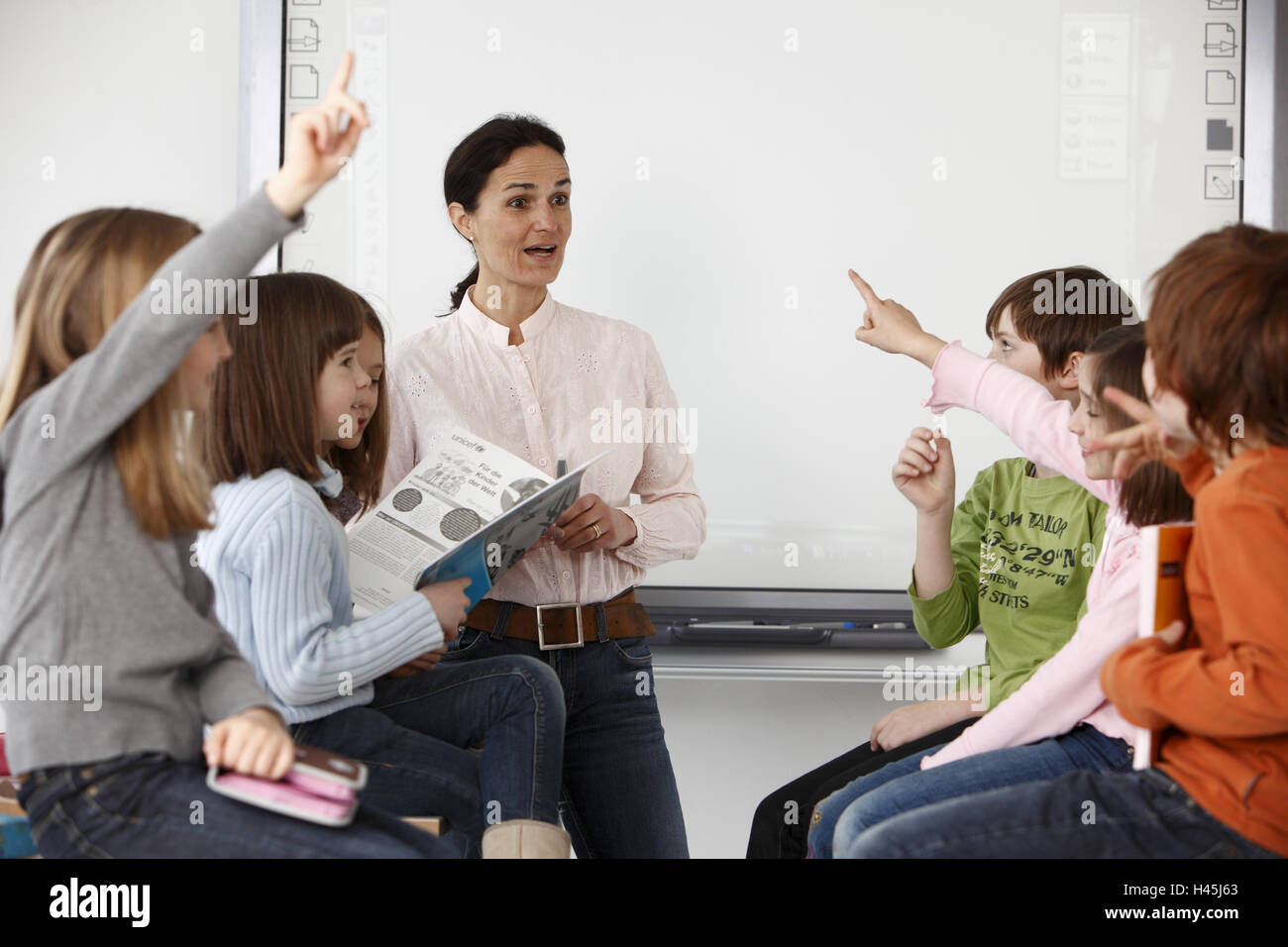 Teacher, schoolboy, elementary school, classroom, lessons, Stock Photo