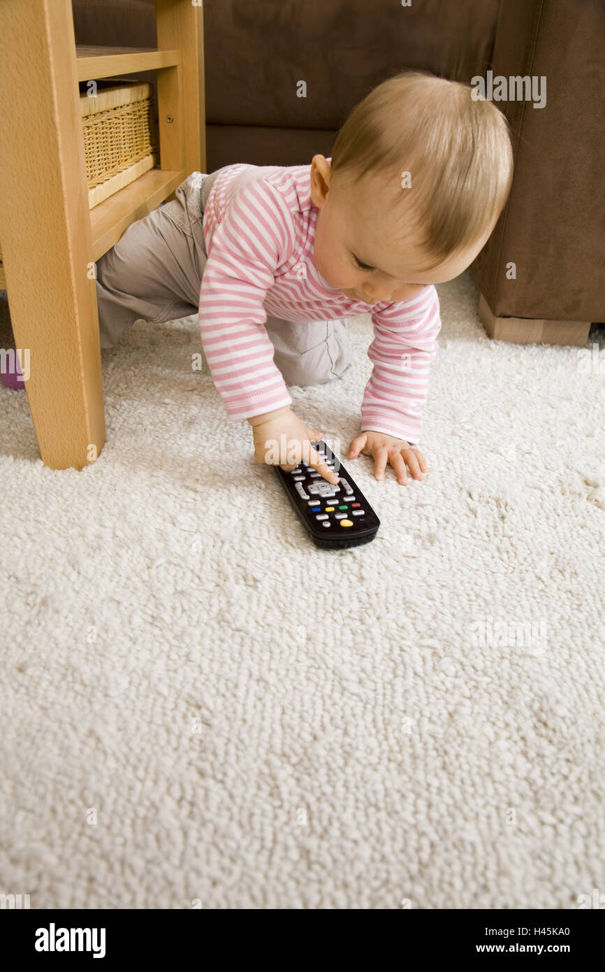 Baby, remote control, play Stock Photo Alamy