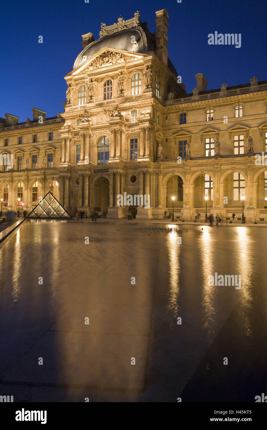 France, Paris, Musee du Louvre, glass pyramid, water pool, lighting, evening, Stock Photo