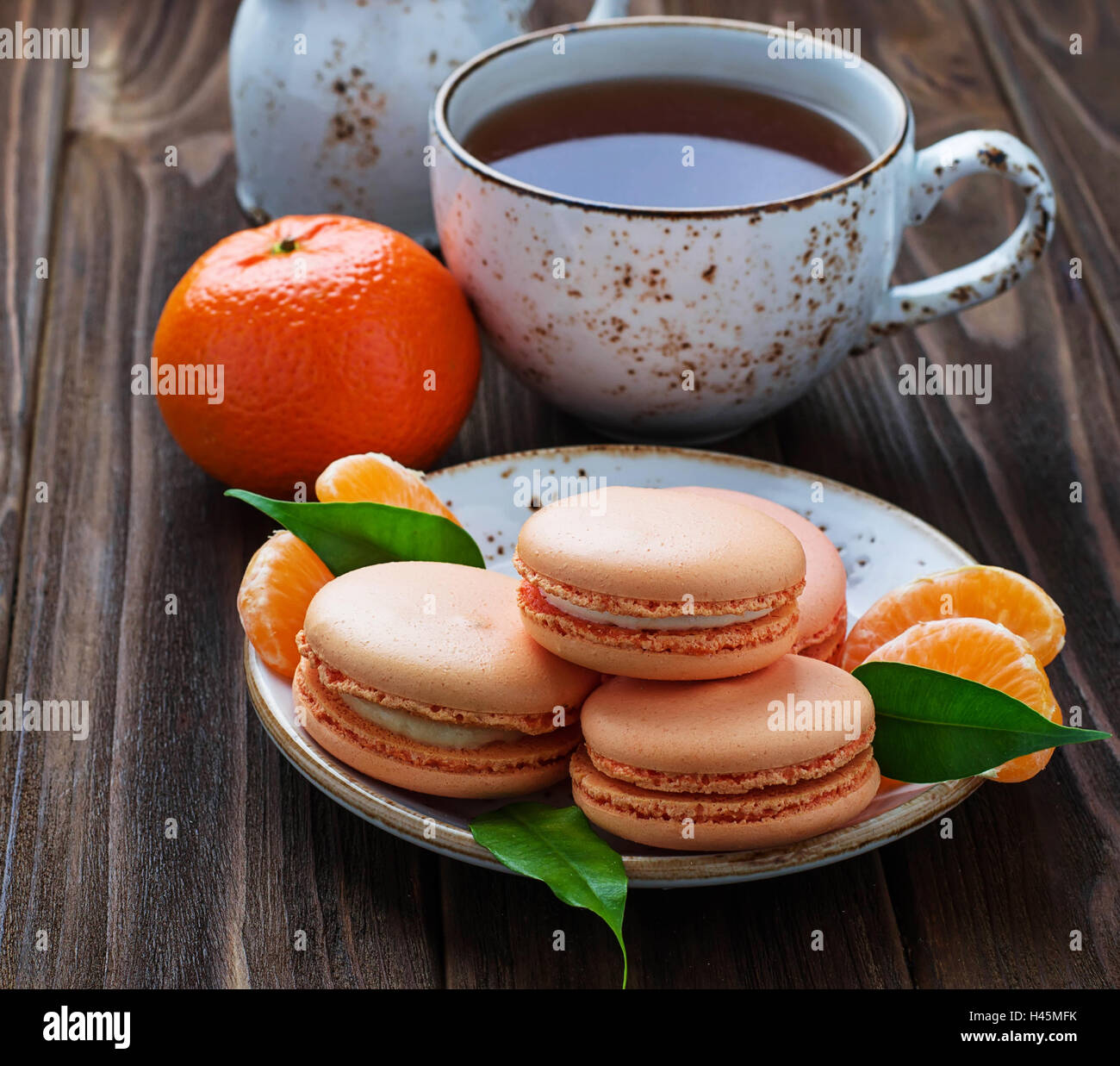 French macaroons with tangerine. Selective focus Stock Photo