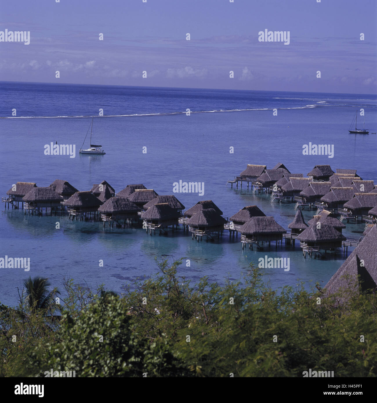 French Polynesia, Moorea, Sofitel, holiday's plant, sea, building on stilts, the Pacific, bridge, wooden jetty, hut, straw roofs, destination, tourism, vacation, Stock Photo