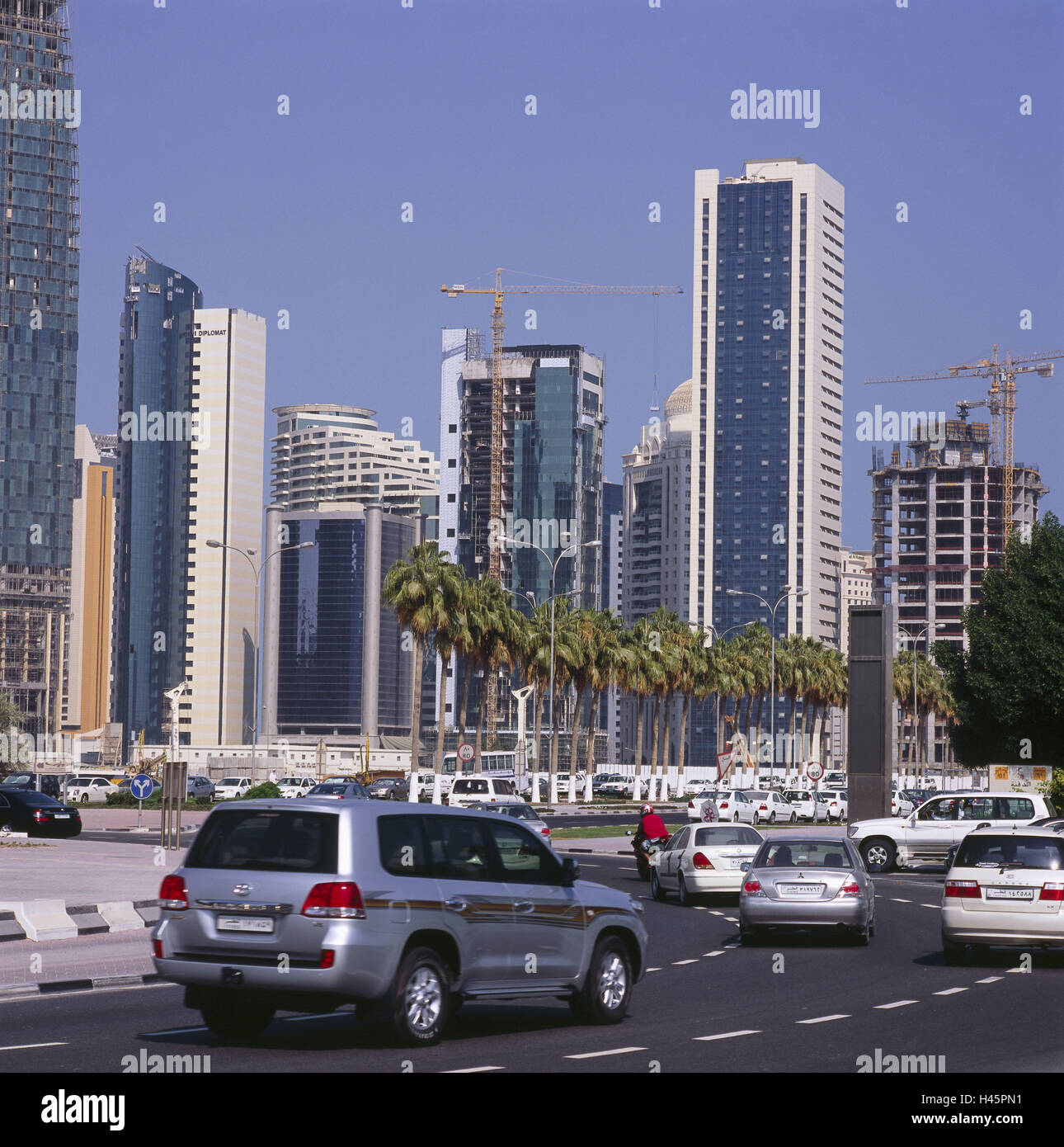 Qatar, Doha, high rises, traffic, cars, sheikdom, town, capital, destination, place of interest, culture, building, architecture, office building, street, traffic, cranes, palms, Stock Photo