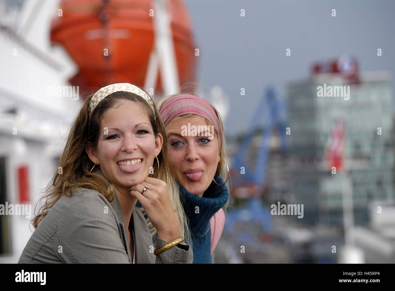 Women, two, young, happy, tongues Rau's passages, portrait, Stock Photo