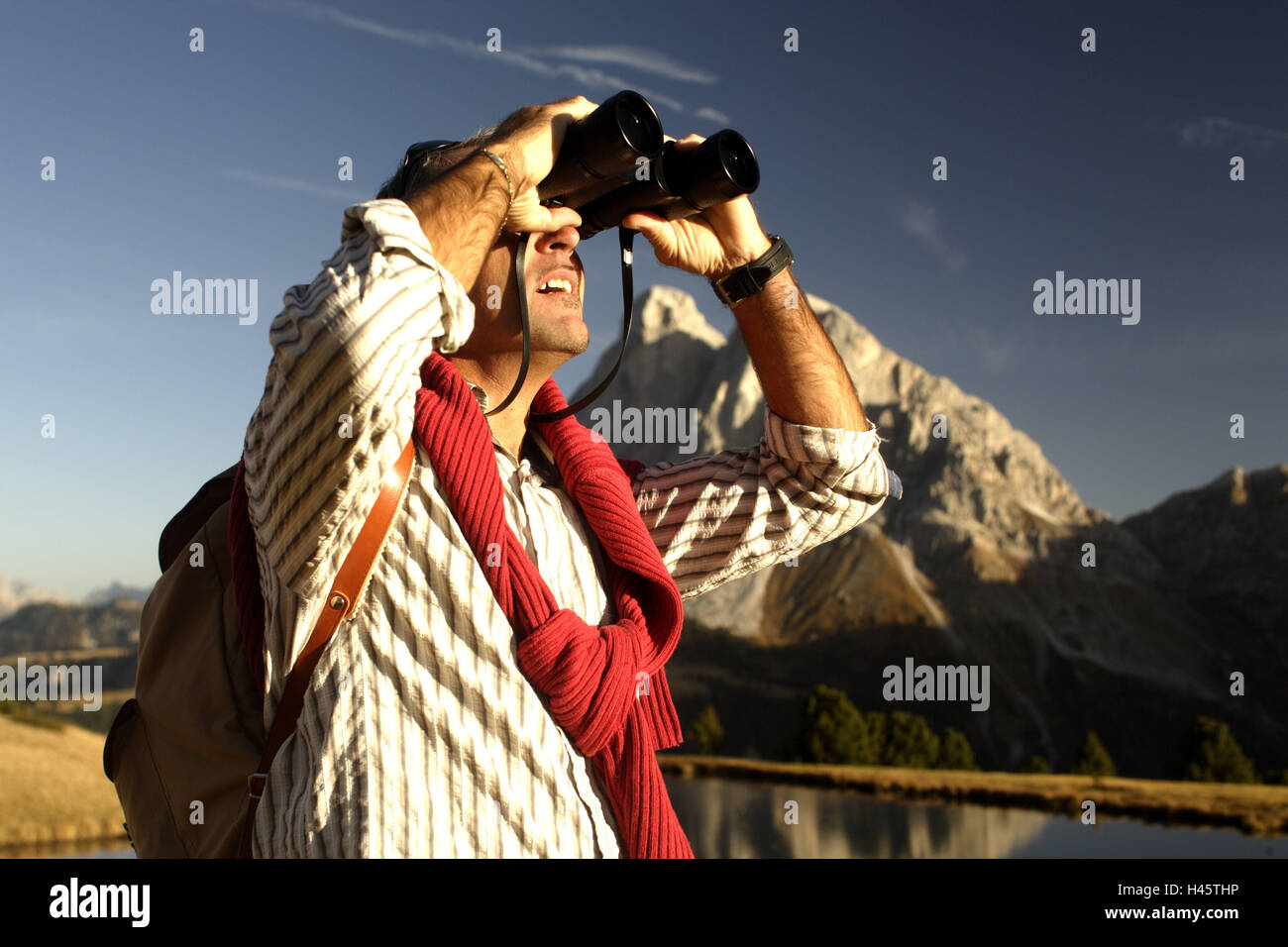 Man, mountain lake, binoculars, gaze, autumn, Tyrol, Italy, Stock Photo