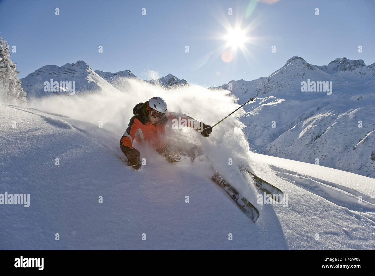 Austria, Vorarlberg, Silvretta Nova, man, young, Freeriding, skiing area, Freeride area, deep-snow-covered, snow-covered, snow, deep snow, powder snow, skiing, trend, the sun, sunrays, people, skiers, man, young, ski helmet, protection, motion, tourism, sport, winter sports, hobby, winter scenery, mountains, alps, weather, clearly, Stock Photo