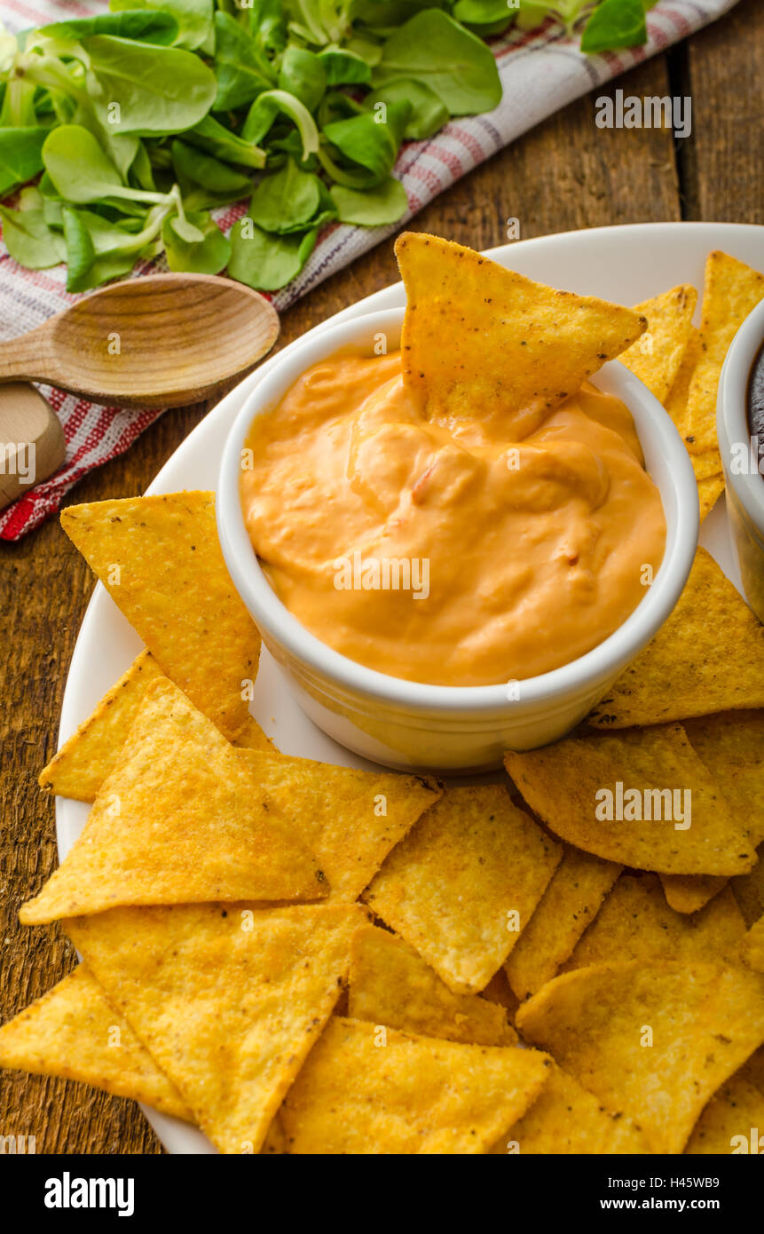 Tortilla chips with cheese dip and barbecue, czech beer Stock Photo Alamy