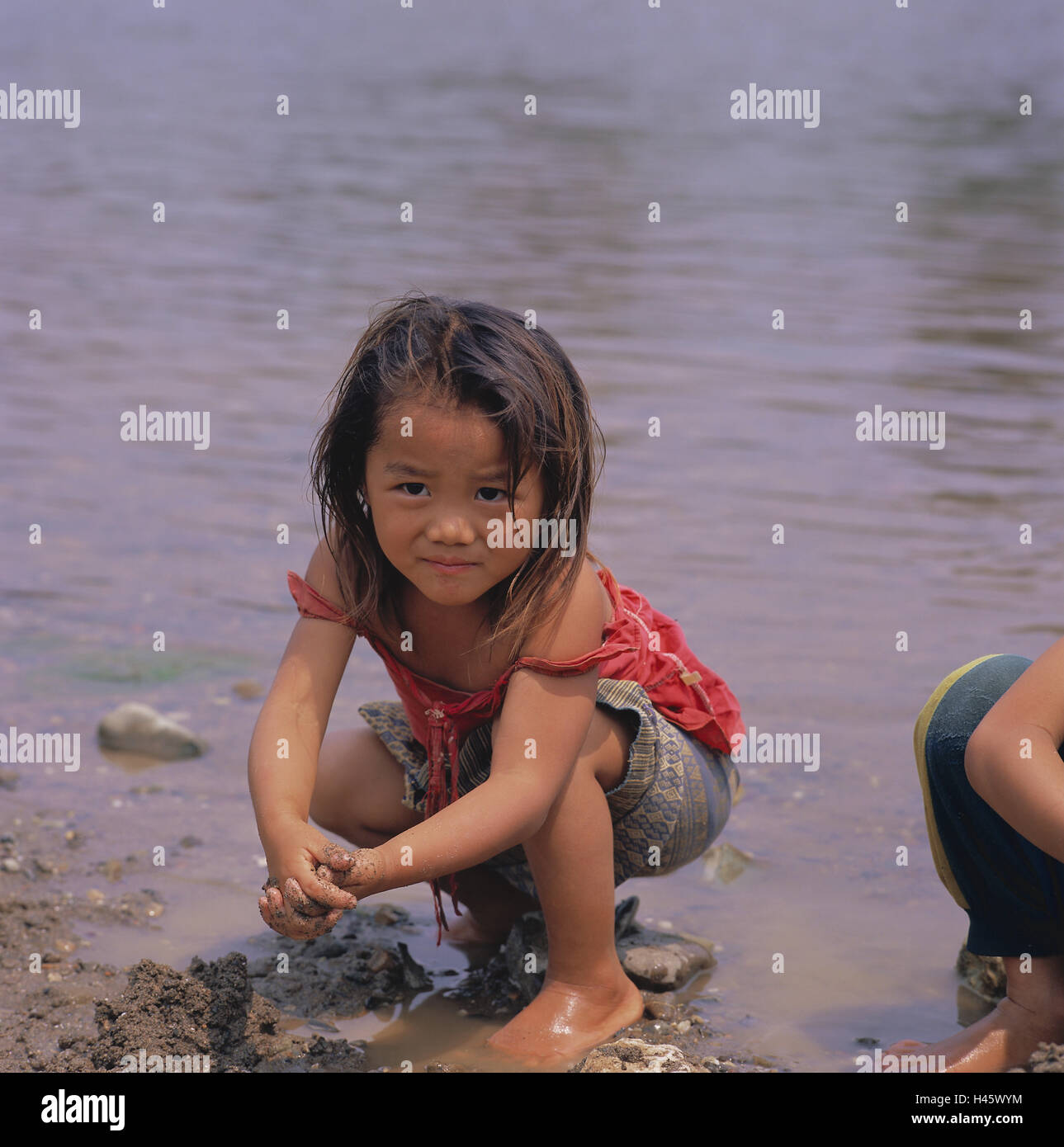 Laos, Vang Vieng, River Nam Song, shore, children, play, girls, squat, no model release, Asia, South-East Asia, destination, locals, people, infant, Asian, dark-haired, swarthy, nicely, water, Stock Photo