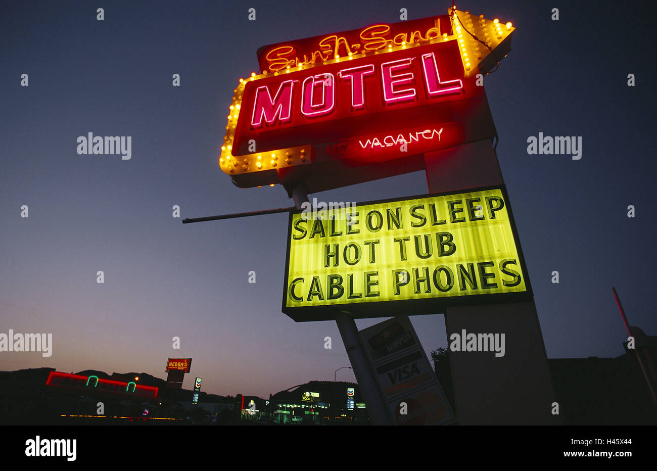 The USA, Kanab, neon lights, motel, evening, Utah, luminous sign, neon child, pointing the way, direction, arrow, stroke, neon writing, shine, accomodation, Stock Photo