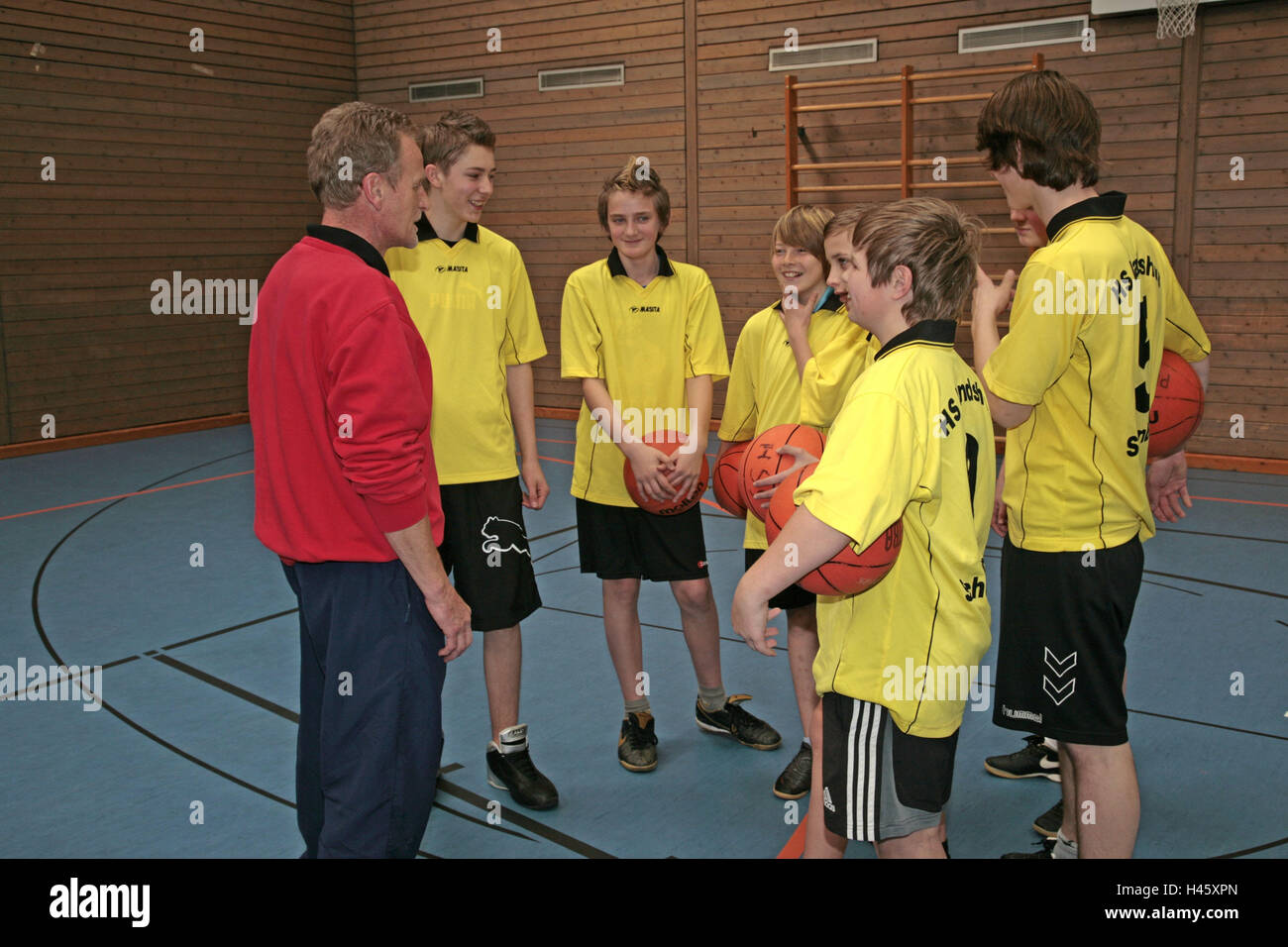 Gymnasium, school sport, boy, basketball, team, balls, hold, manager, discussion, model released, people, inside, school, seven, team, group, team's recording, basketball, team's jerseys, youth, sport, school sport, team, training, condition, motion, perseverance, sports club, togetherness, social behaviour, fairness, team sport, sport, ball game, man, teacher, Stock Photo