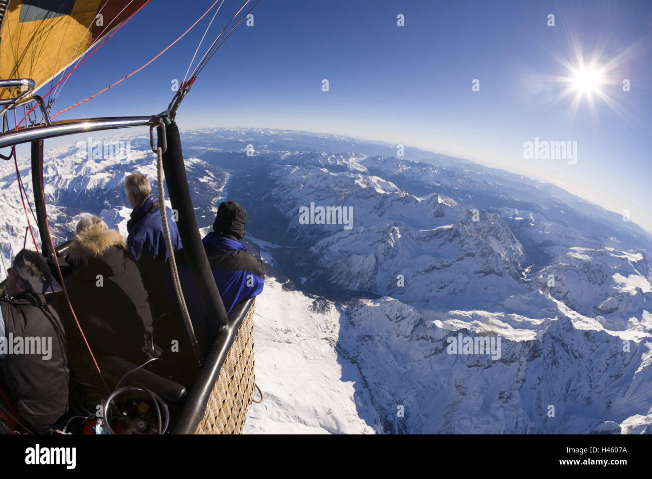 Italy, Gardasee, hot-air balloon, passengers, flight, view, mountains, sun, Alpenüberquerung, alps, hot-air balloon, balloon ride, balloon, basket, balloon basket, gas burner, leisure time, hobby, sport, float, people, tourism, scenery, mountain landscape, sunlight, snow, season, winter, Stock Photo