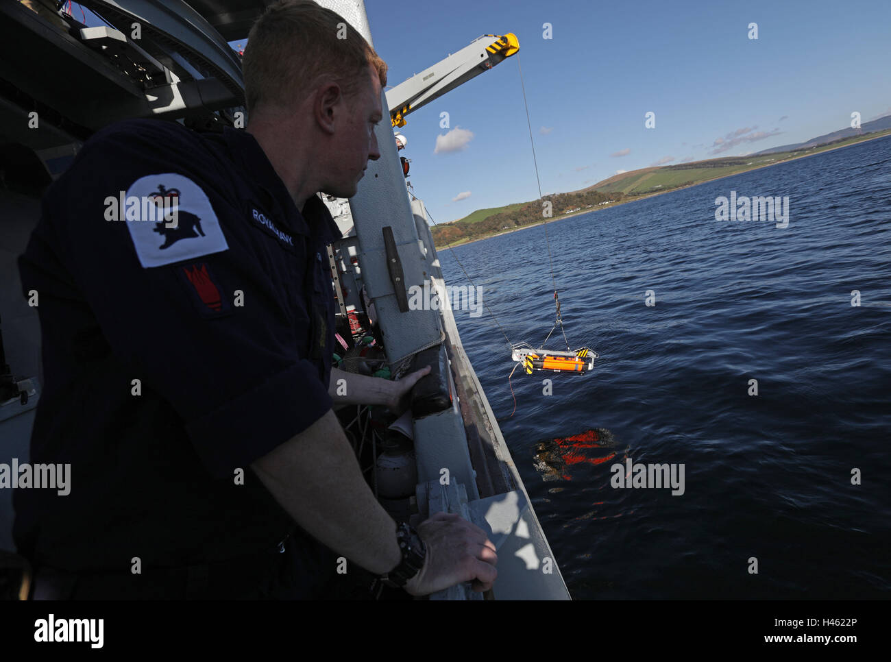 A Seafox unmanned underwater vehicle is lifted overboard HMS Cattistock - a Royal Navy Hunt-class mine countermeasures vessel - in the Lochs of western Scotland, during a Royal Navy Joint Warrior training exercise. Stock Photo