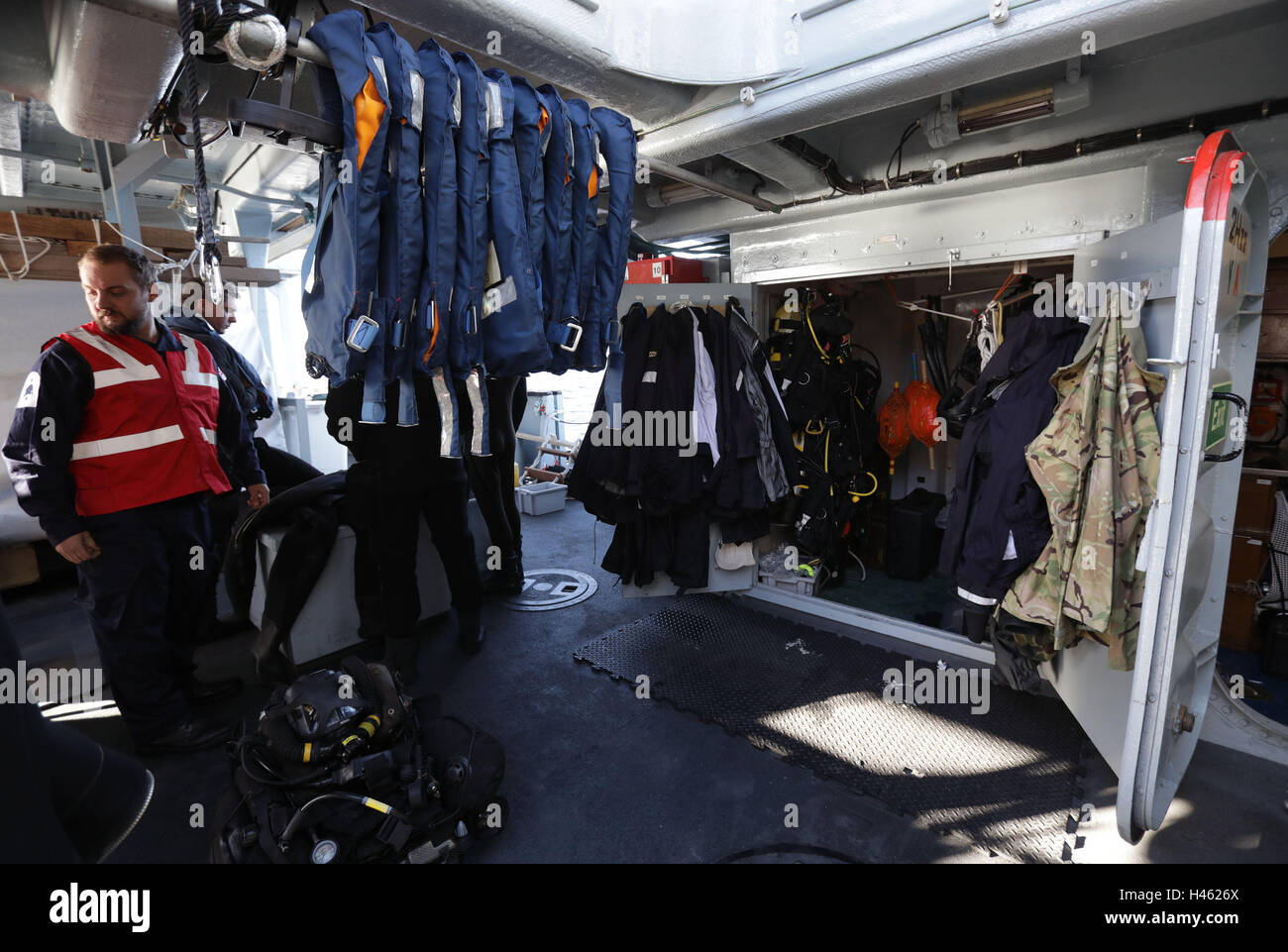 Life jackets and diving kit on board HMS Cattistock - a Royal Navy Hunt-class mine countermeasures vessel - in the Lochs of western Scotland, during a Royal Navy Joint Warrior training exercise. Stock Photo