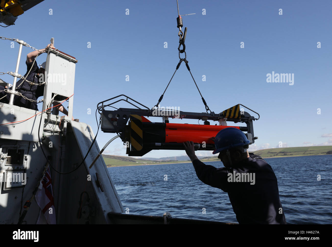 A Seafox unmanned underwater vehicle is lifted overboard HMS Cattistock - a Royal Navy Hunt-class mine countermeasures vessel - in the Lochs of western Scotland, during a Royal Navy Joint Warrior training exercise. Stock Photo