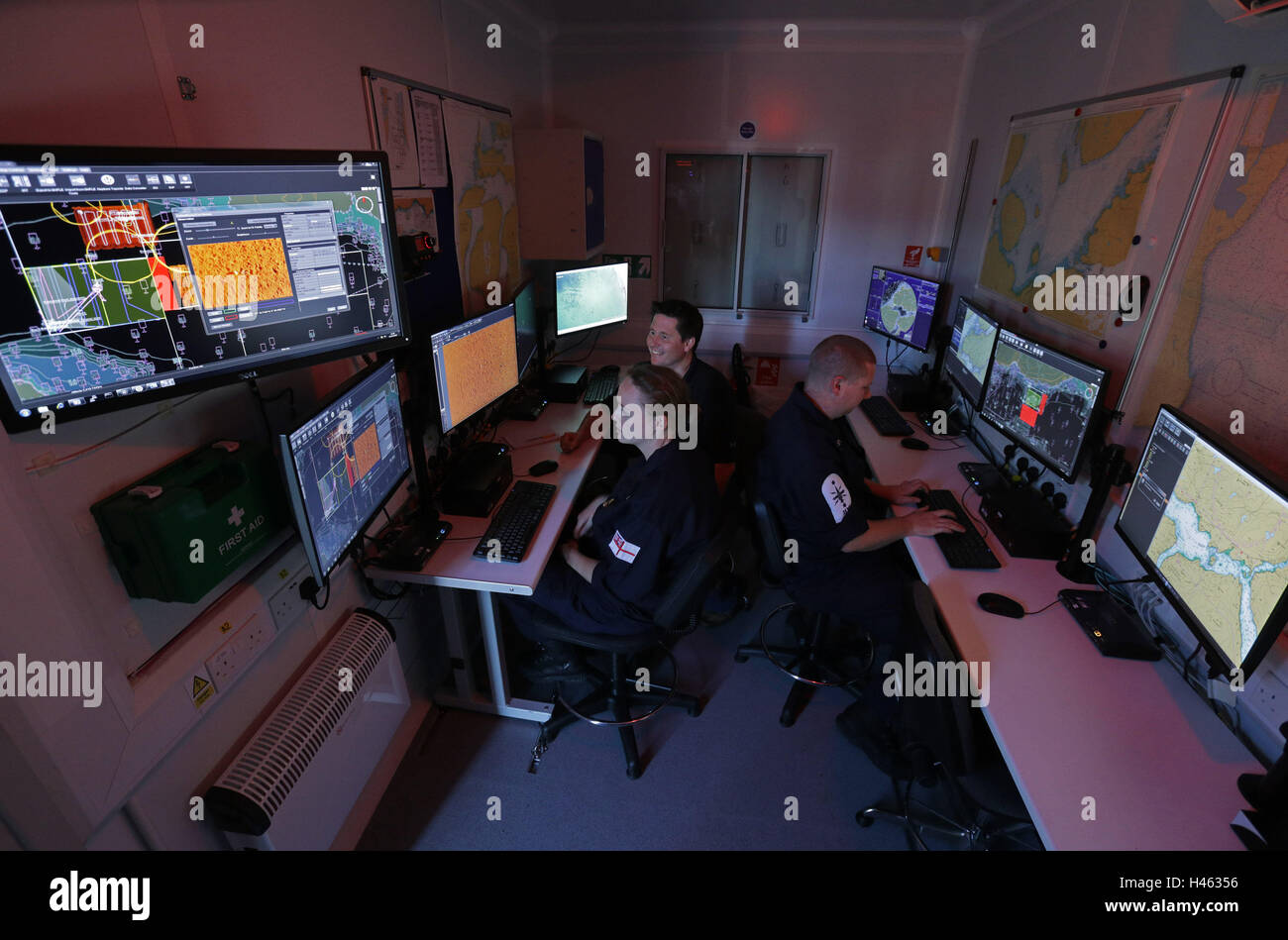 Royal Navy and industry personnel in a command and control cabin at the Qineti BUTEC facility - conducting planning, monitoring and post-mission analysis of autonomous unmanned systems - during a Royal Navy Unmanned Warrior exercise, at Kyle of Lochalsh, Scotland. Stock Photo