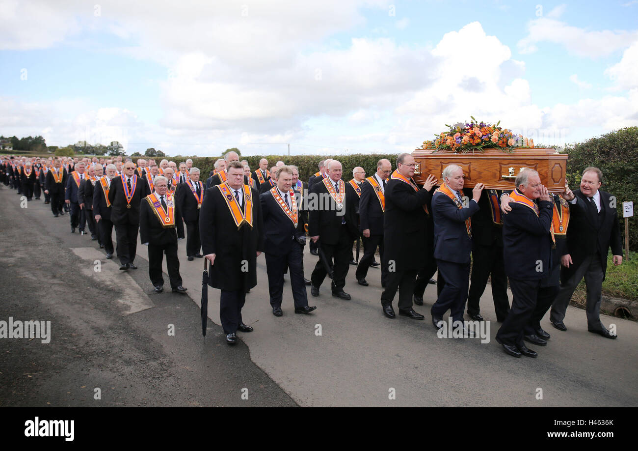 The coffin of high profile Orangeman Drew Nelson makes its way to St John's Church, Hillsborough Co Down, during his funeral. Stock Photo