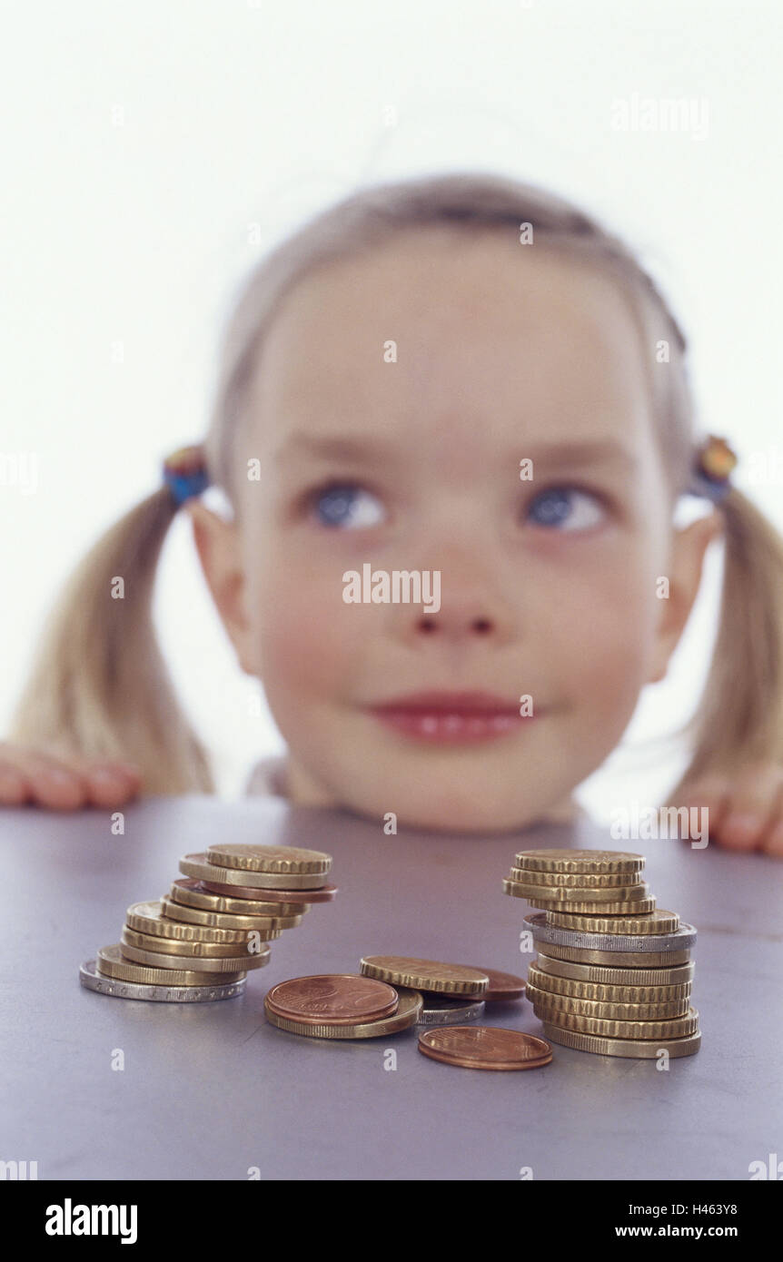Girl, table edge, chin, leaning, coins, stacked, portrait Stock Photo -  Alamy