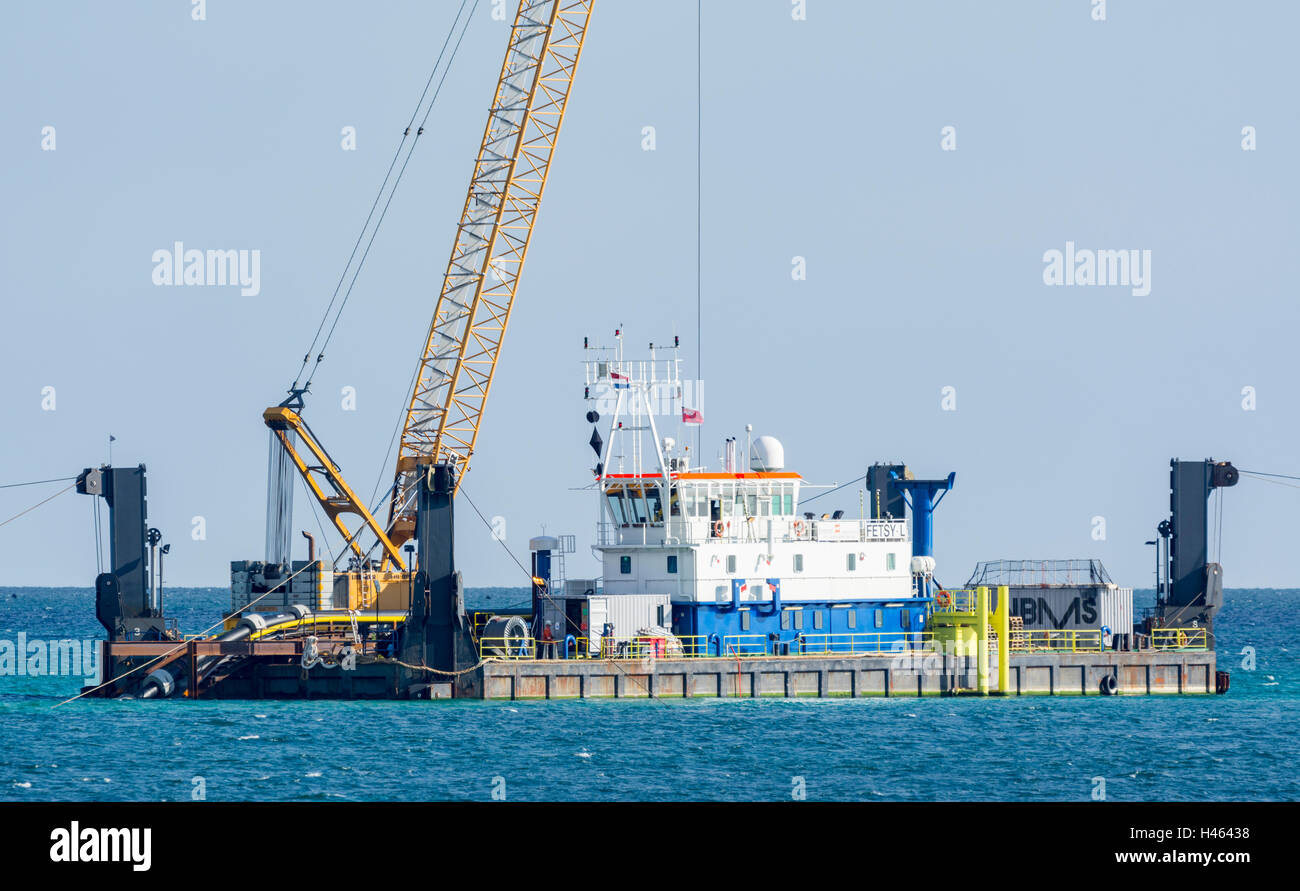 Underwater cable laying platform at sea, off the southern UK coast, as part of wind turbine installation. Stock Photo